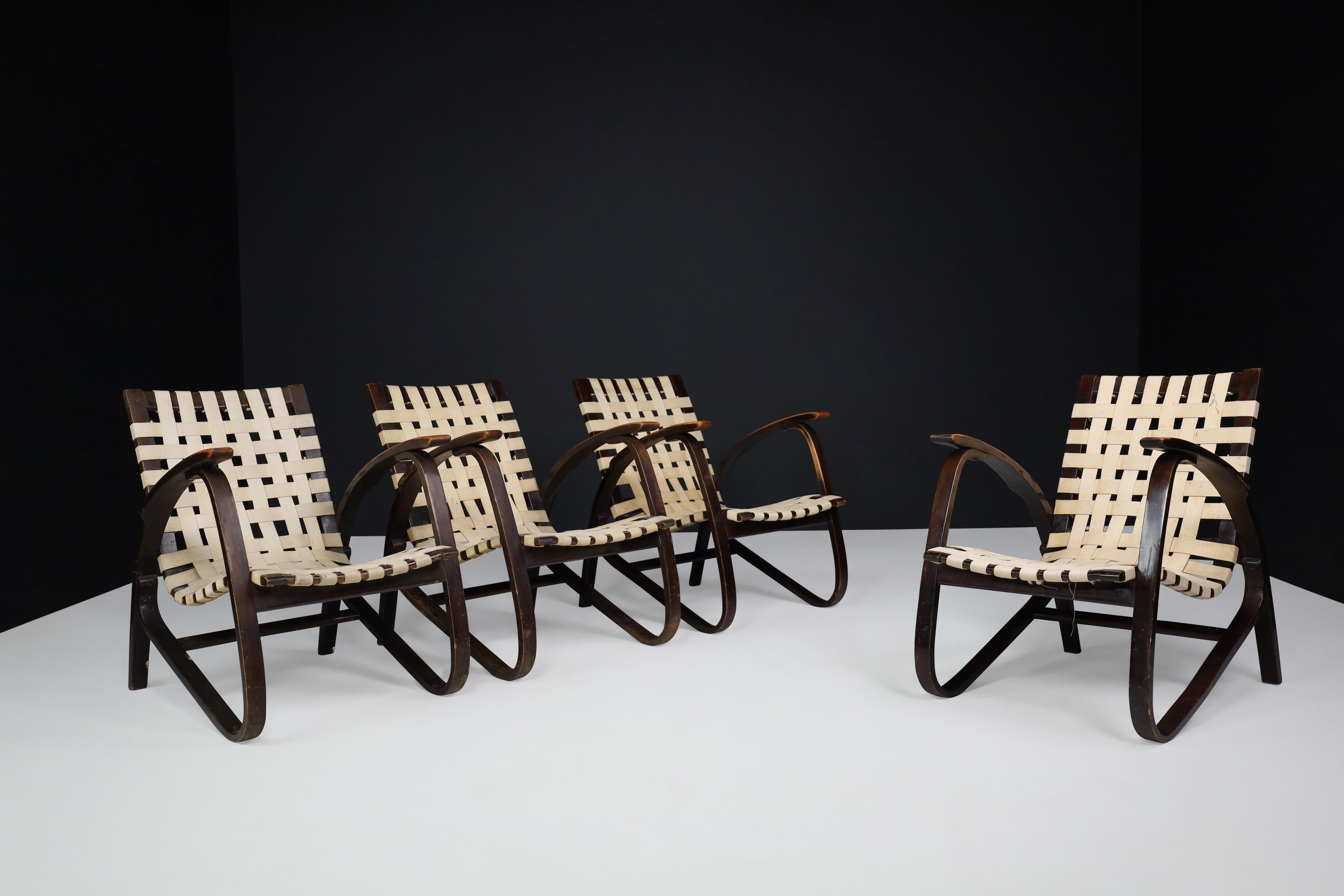 Jan Vanek pair of four lounge chairs in bentwood and patinated canvas, Praque 1940s

Pair of four elegant armchairs designed by Czech architect Jan Vanek in the 1940s, who was a contemporary of Jindrich Halabala. These chairs are upholstered with