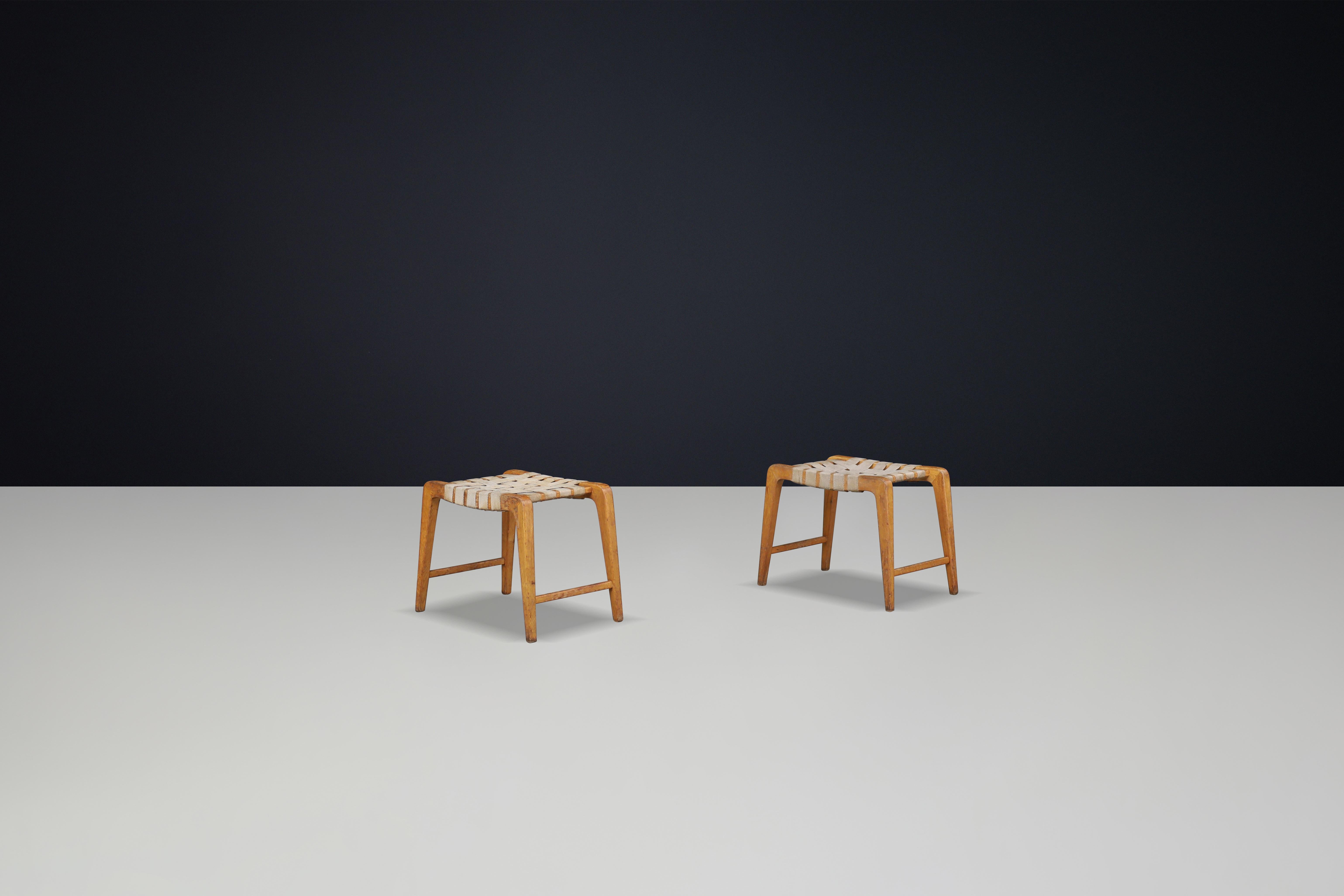 20th Century Jan Vanek sculptural set of two oak stools featuring woven canvas straps, 1940s For Sale