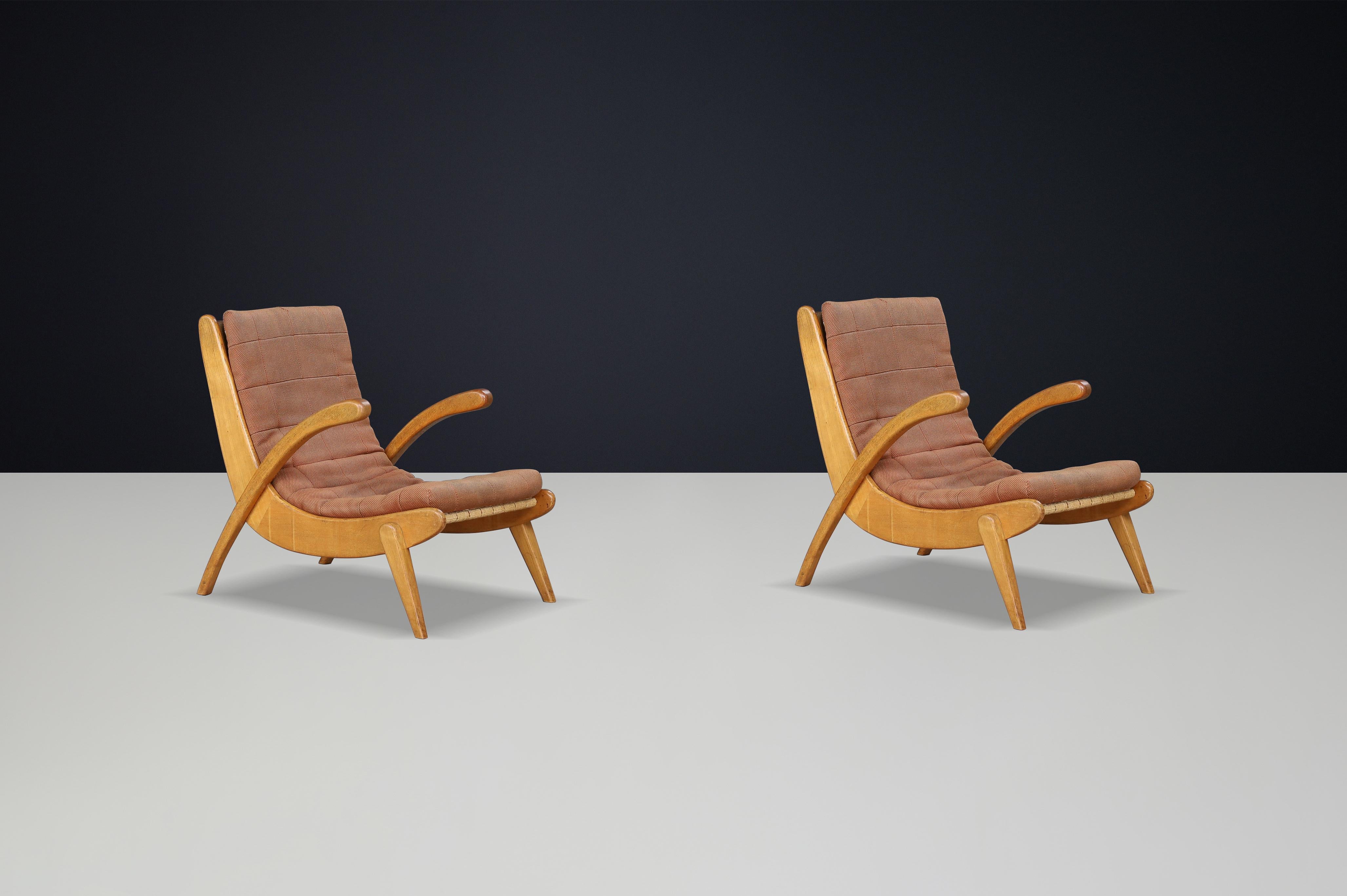 Jan Vanek's pair of two curved easy chairs with curved oak, canvas, and original upholstery, CZ 1960s

Jan Vanek's pair of two curved easy chairs, crafted from oak and featuring woven canvas straps with original upholstery, dates back to the 1940s