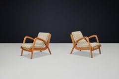 Jan Vanek's pair of two curved easy chairs curved oak and original upholstery.