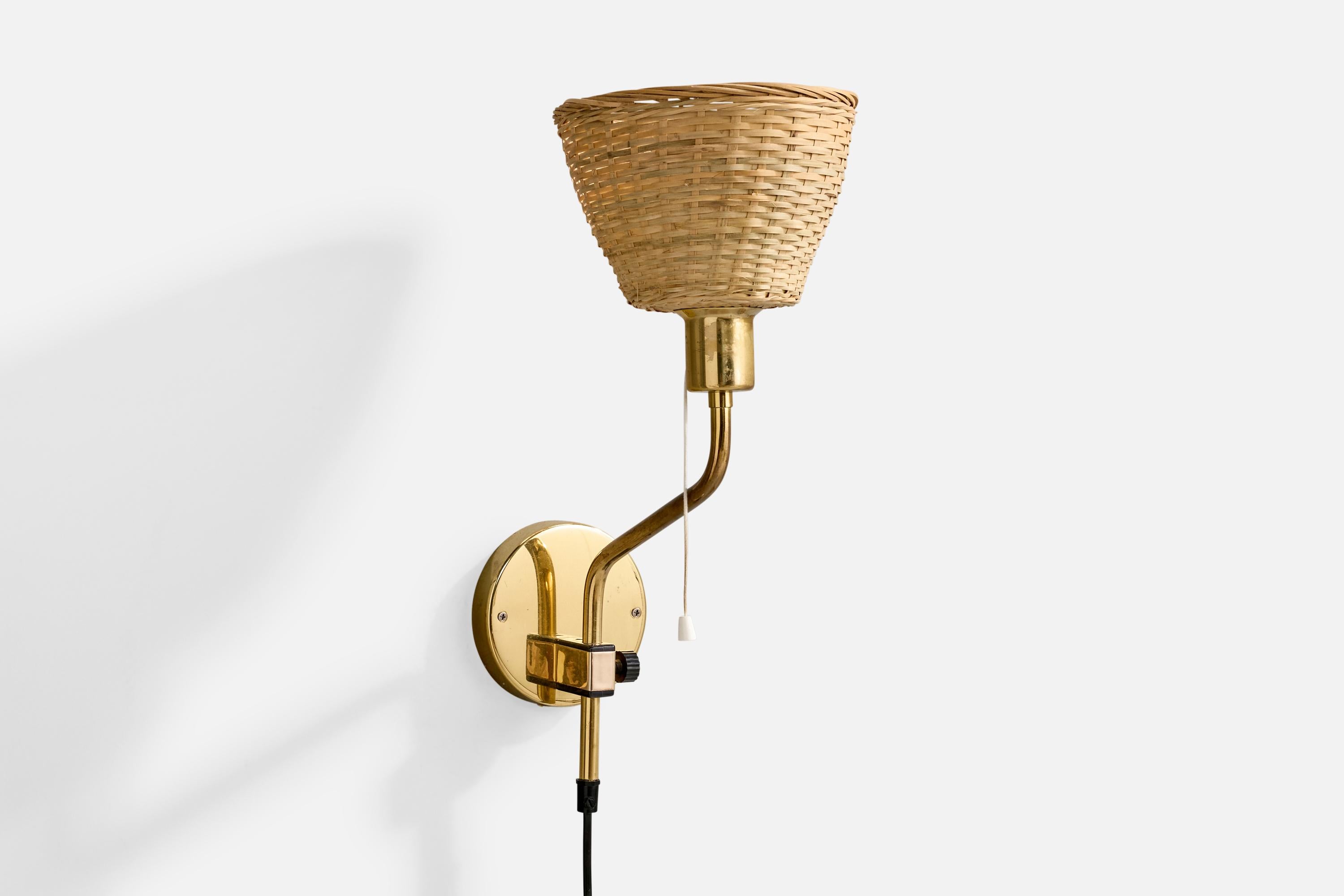 Applique réglable en laiton, plastique et rotin conçue par Jan Wickelgren et produite par Aneta, Suède, c.C. 1980.

L'oxydation est présente sur l'ensemble de la lampe.

Remplacement de l'abat-jour.

Dimensions globales (pouces) : 18 