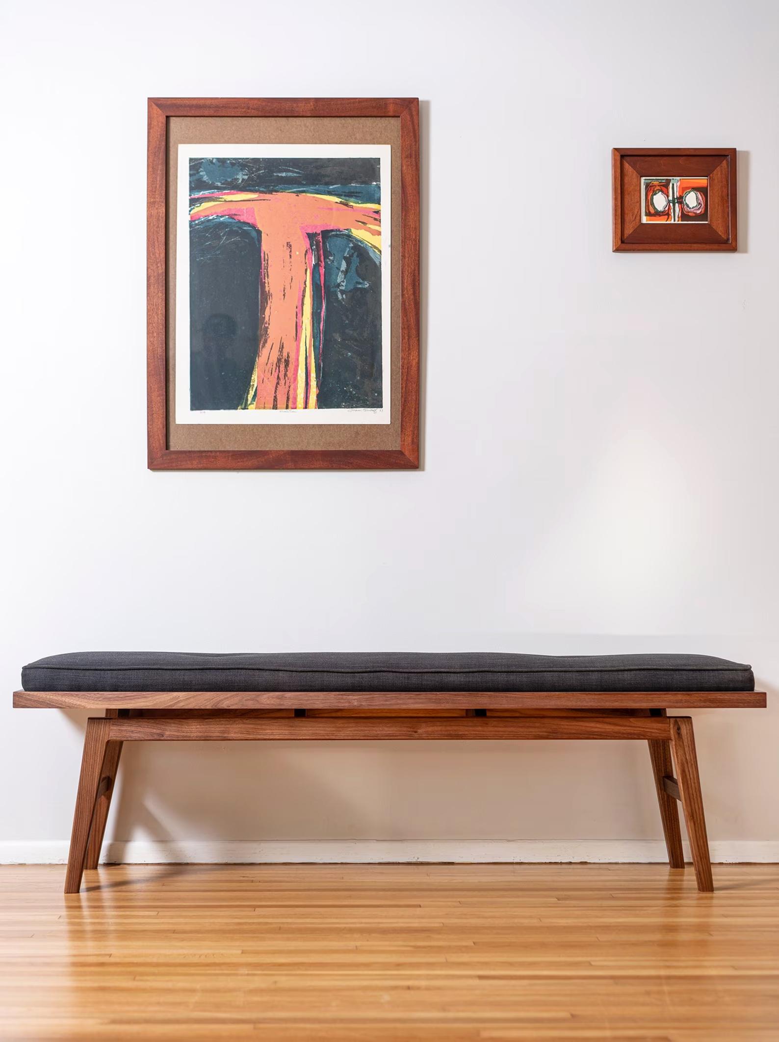 The Jana entry bench is an original design, rooted in my love of all things modern, mid century, and Scandanavian. It's lovingly hand-built by me and my team from solid walnut (other woods available upon request), and the cushion is hand crafted by