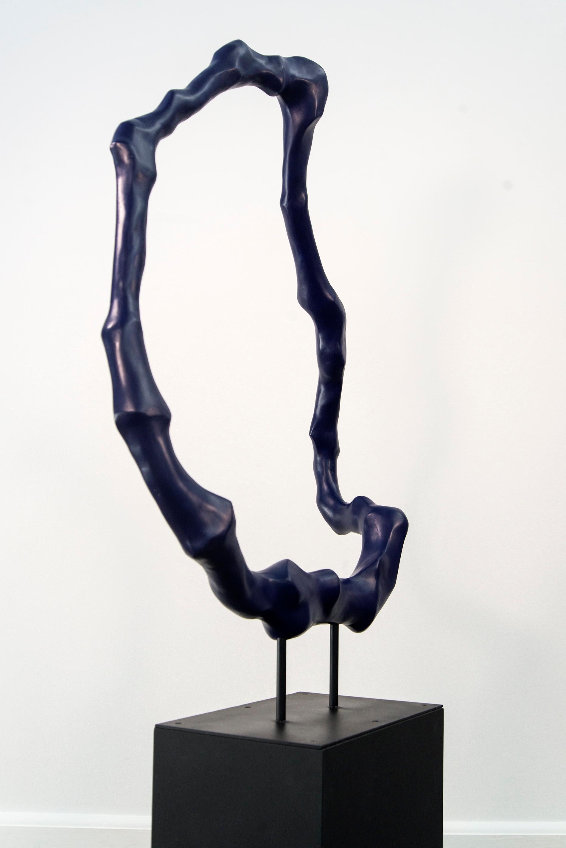The natural world inspires the beautiful organic forms of artist Jana Osterman. This deep blue patinated winterstone sculpture suggests the shape and movement of tree roots. It is polished with a protective wax giving it a light sheen. 

“Tree roots