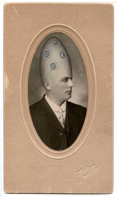 untitled (man with tall head and additional eyes)