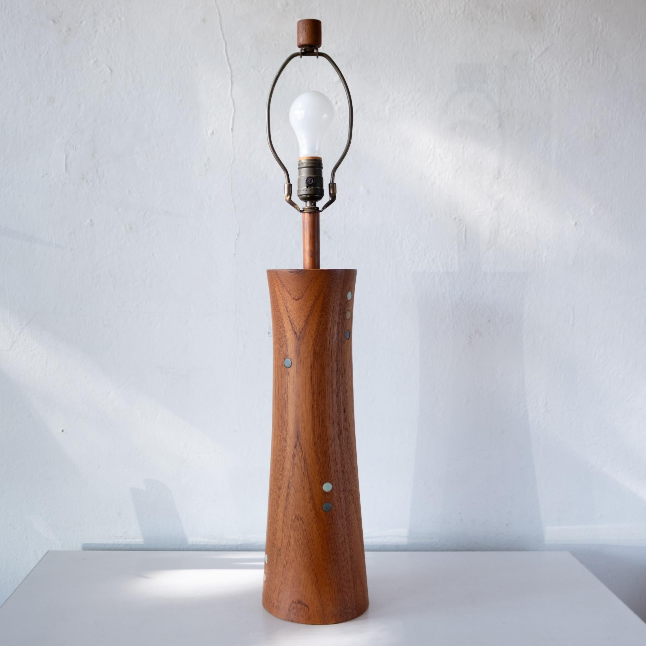 Turned walnut lamp with ceramic inlay by Jane and Gordon Martz for their company, Marshall Studios. Solid walnut with ceramic inlay around the perimeter. 

Dimension: 5.75