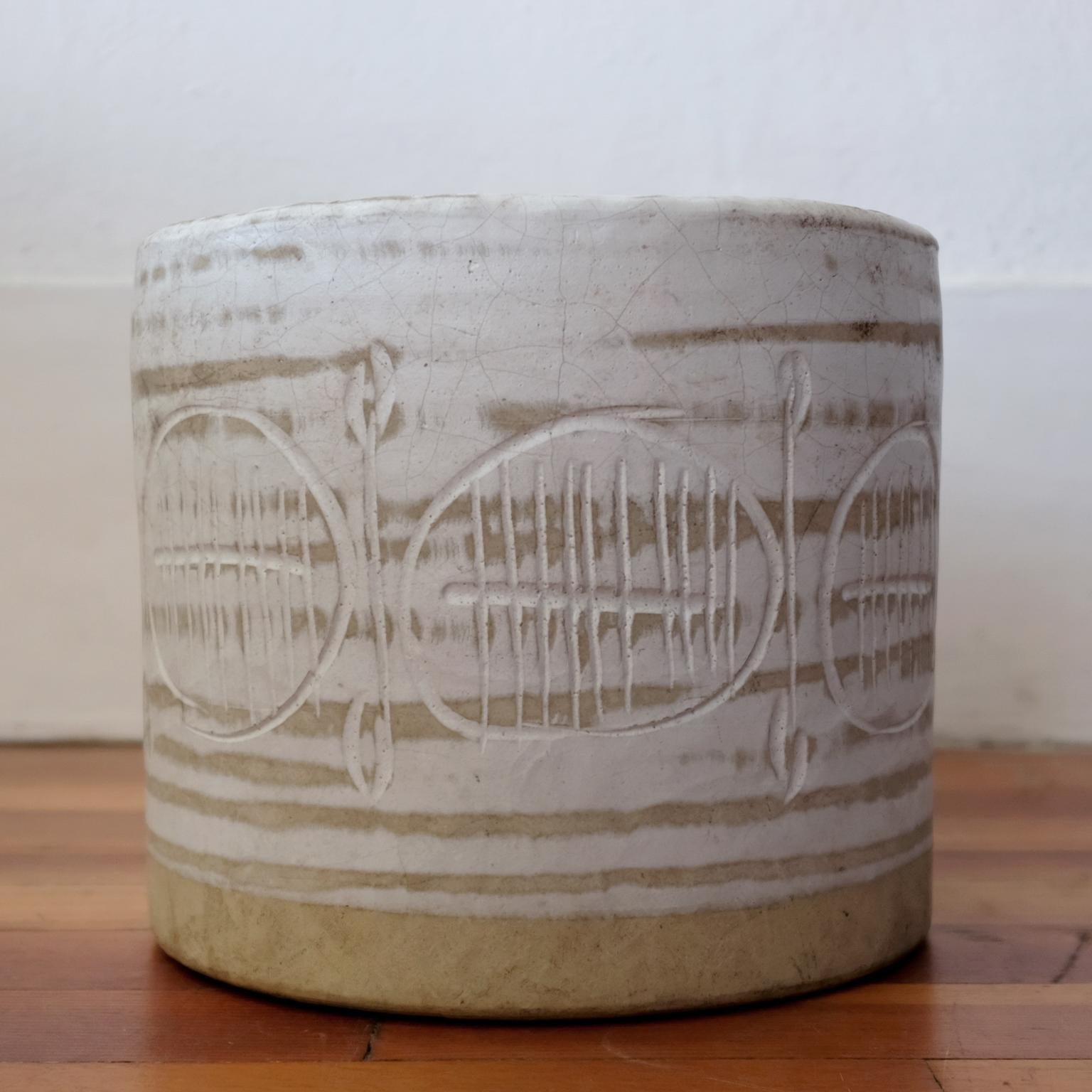 Ceramic planter by Jane and Gordon Martz for their company, Marshall Studios. Natural tan clay, brushed white glaze and an incised decoration around the entire planter. Hand formed, 1950s.