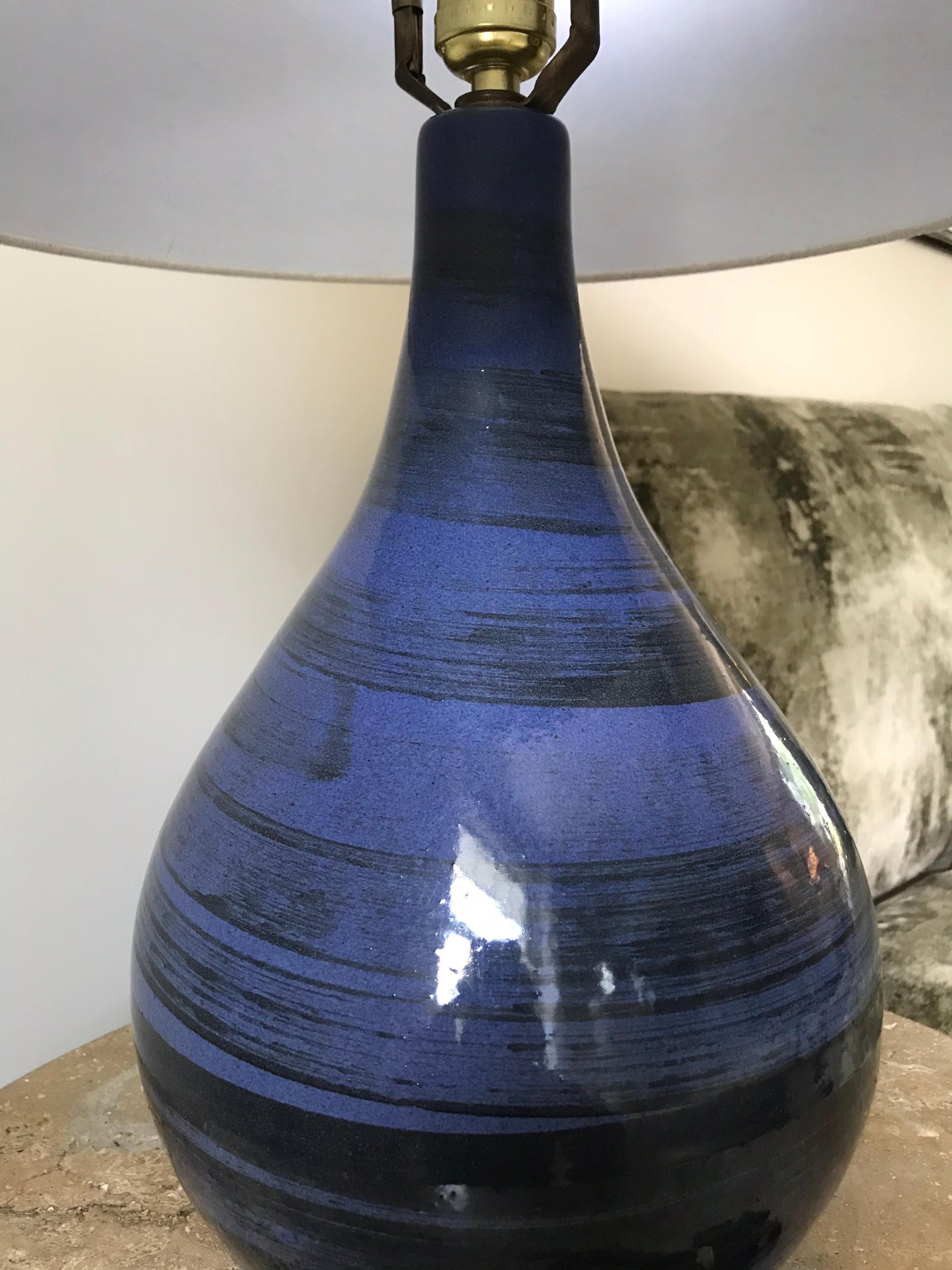 Iconic teardrop table lamp by ceramicist duo Jane and Gordon Martz for Marshall Studios. Beautiful form coupled with a classic Royal blue and black swirled design.

New harp, new shade, new finial. Wiring appears to have been updated at some
