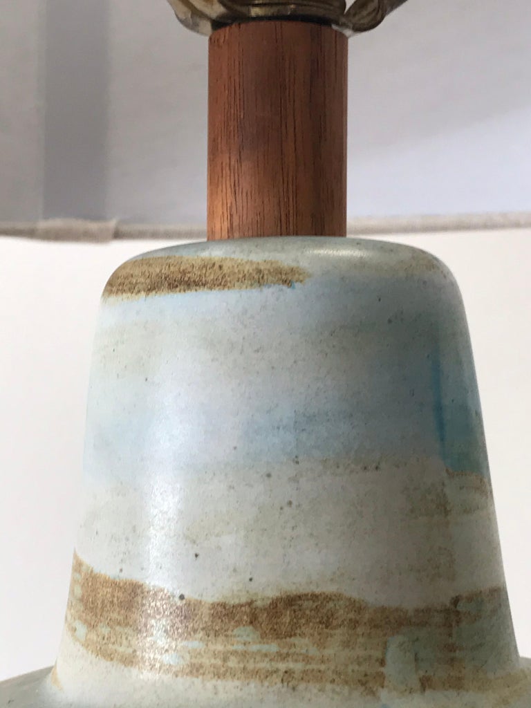 Wonderful ceramic table lamp by Jane and Gordon Martz table lamp for Marshall Studios. Beautiful colors throughout including blue, yellow, and ochre. New shade.

Overall:
23