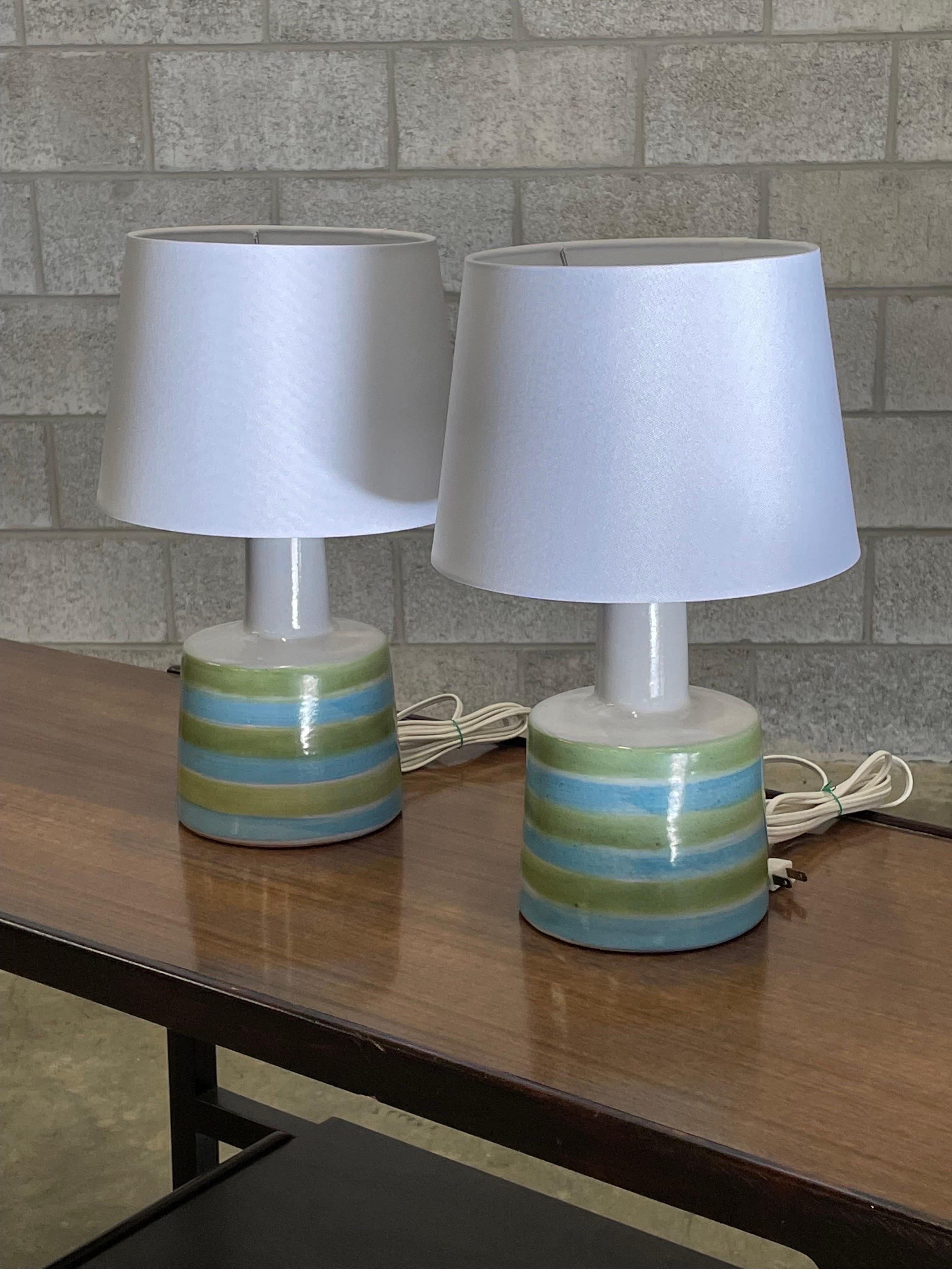 Table lamps designed by ceramicist duo Jane and Gordon Martz for Marshall Studios. Color is a main white body with green and blue stripes.

Overall dimensions: 16” tall 10” wide.
Ceramic portion only 9” tall 6” across.