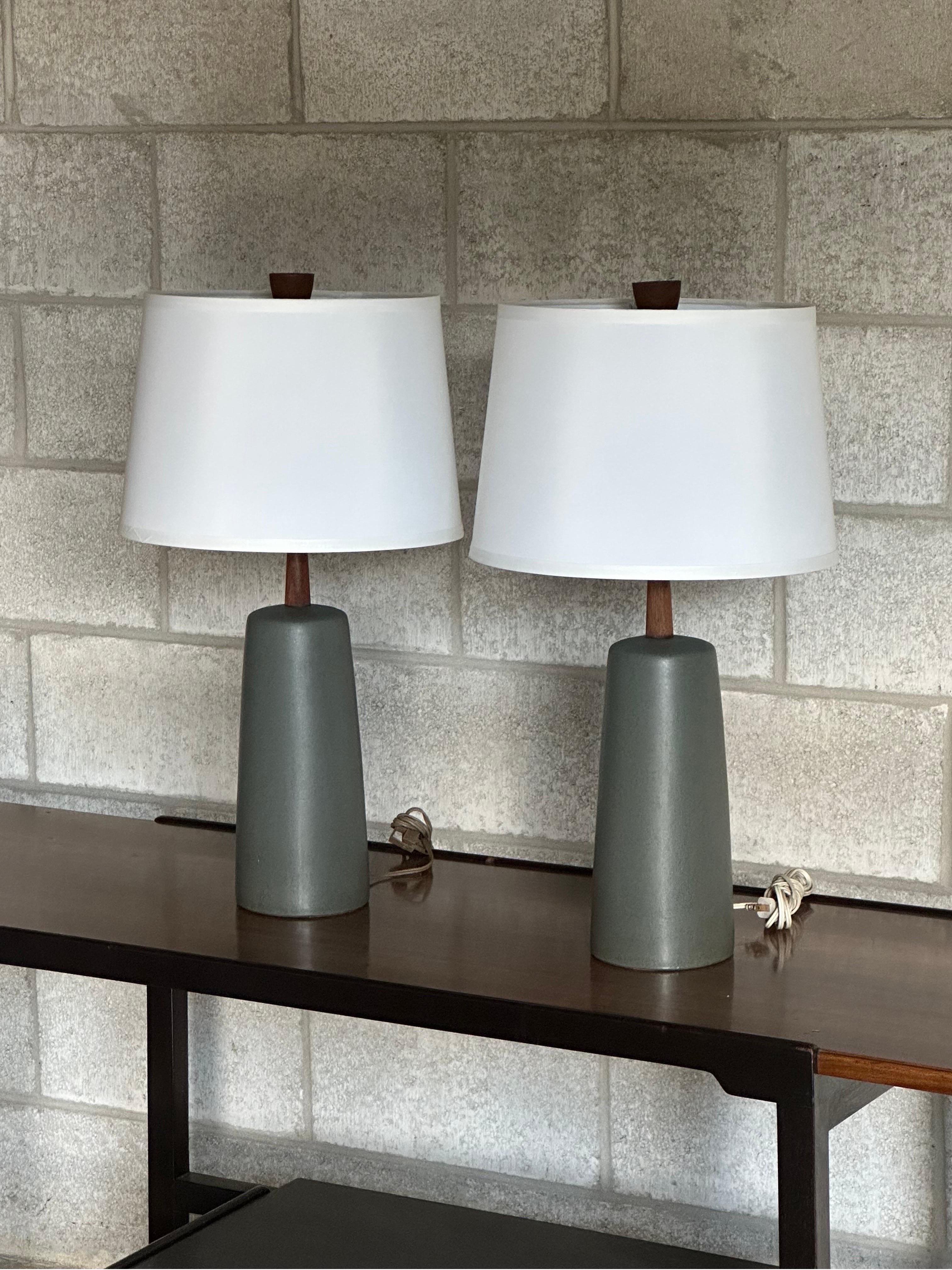 A pair of table lamps by famed ceramicist duo Jane and Gordon Martz for Marshall Studios. Featuring a wonderful turquoise body with walnut neck and finial.

Dimensions-
Overall
24” tall
13” wide

Ceramic only 
12” tall
5” wide 
