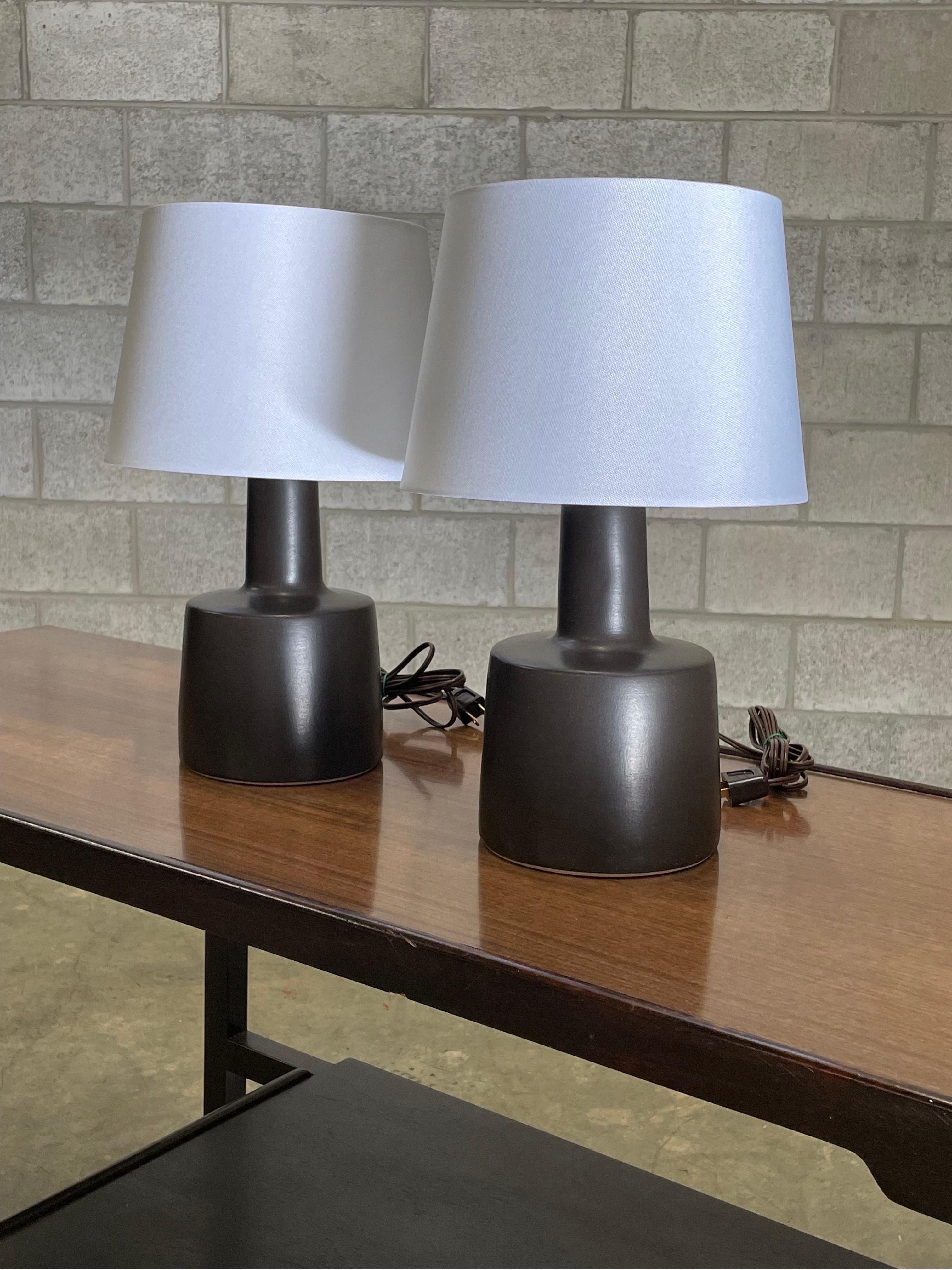 Table lamps designed by ceramicist duo Jane and Gordon Martz for Marshall Studios. Color is matte or flat black. 

Overall dimensions: 16” tall 10” wide 
Ceramic portion only 9” tall 6” across.
