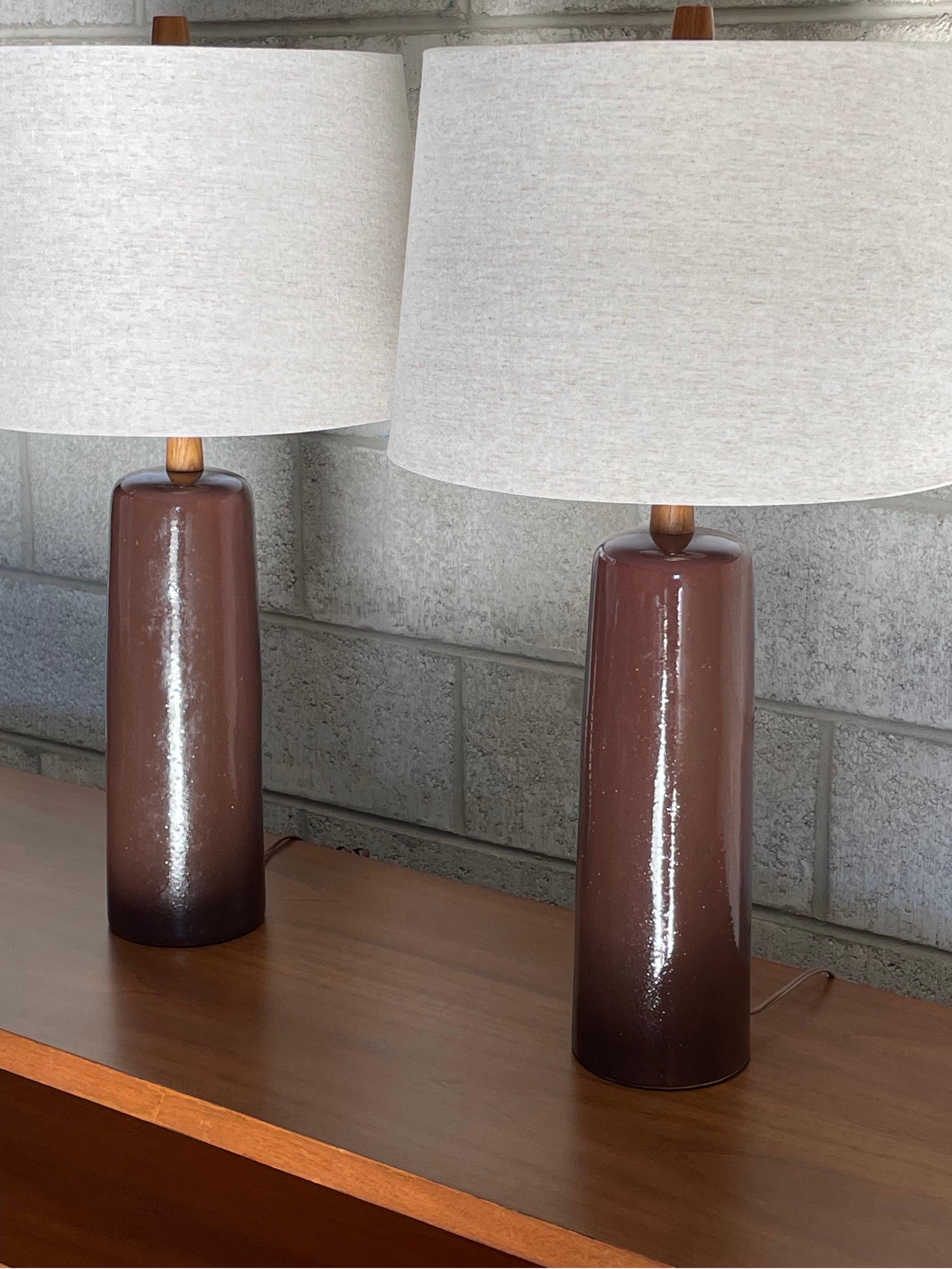 Table lamps designed by ceramicist duo Jane and Gordon Martz for Marshall Studios. Color a brown with some hues of plum.

Dimensions
Overall;
27.25” tall
15” wide 

Ceramic ;
14