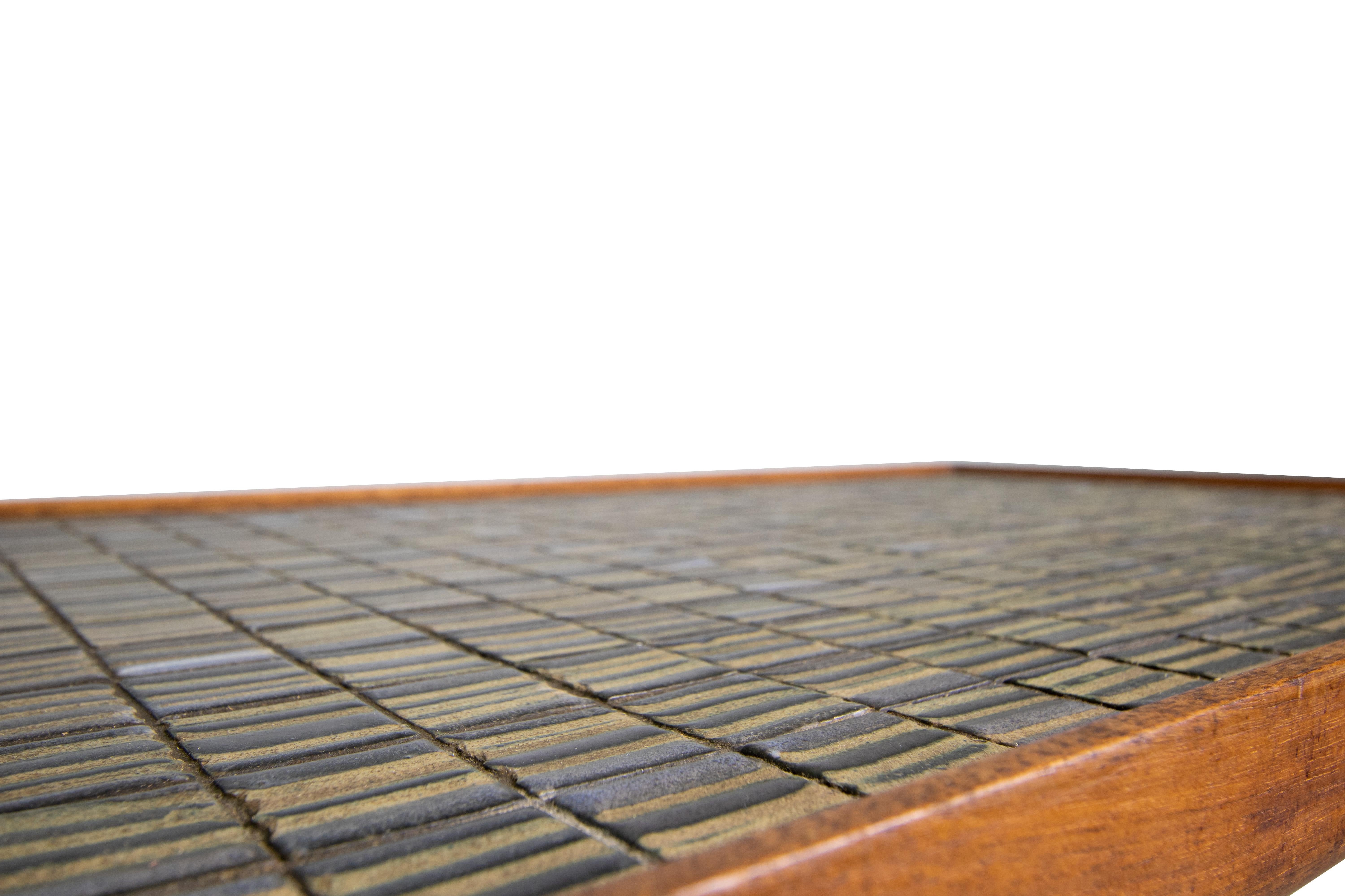 An original occasional table by Jane and Gordon Martz for Marshall Studios. The ceramic tile has a unique glaze, in grays, earth tones and blues, that I haven't found on any other Martz pieces. 

Dimensions:
W 20