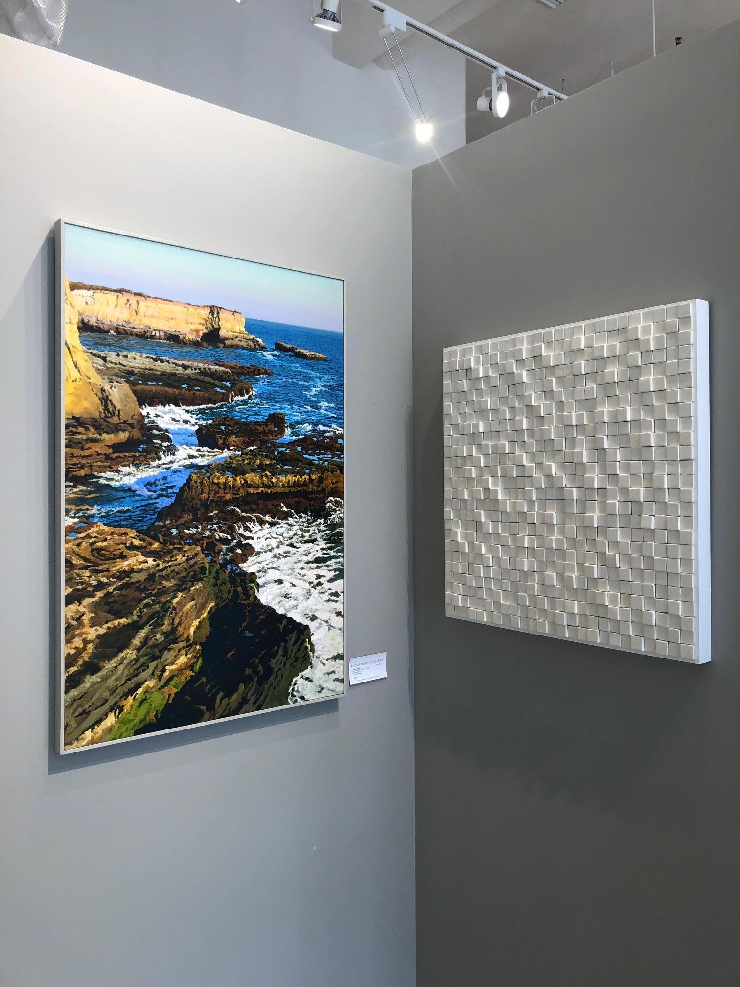 Abstract Ceramic textural 3D three dimensional wall sculpture in pure white. Natural abstract geometric work created with ceramic squares mounted to a wood panel, from Pop Art pioneer Jane B. Grimm, whose minimal and meditative sculptures and wall
