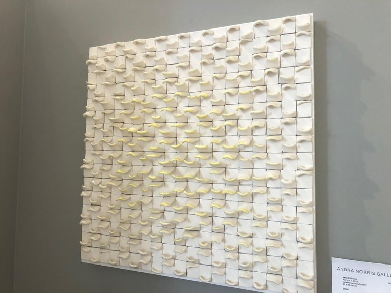 Allegro I / ceramic wall sculpture - white with ivory / yellow - Abstract Sculpture by Jane B. Grimm