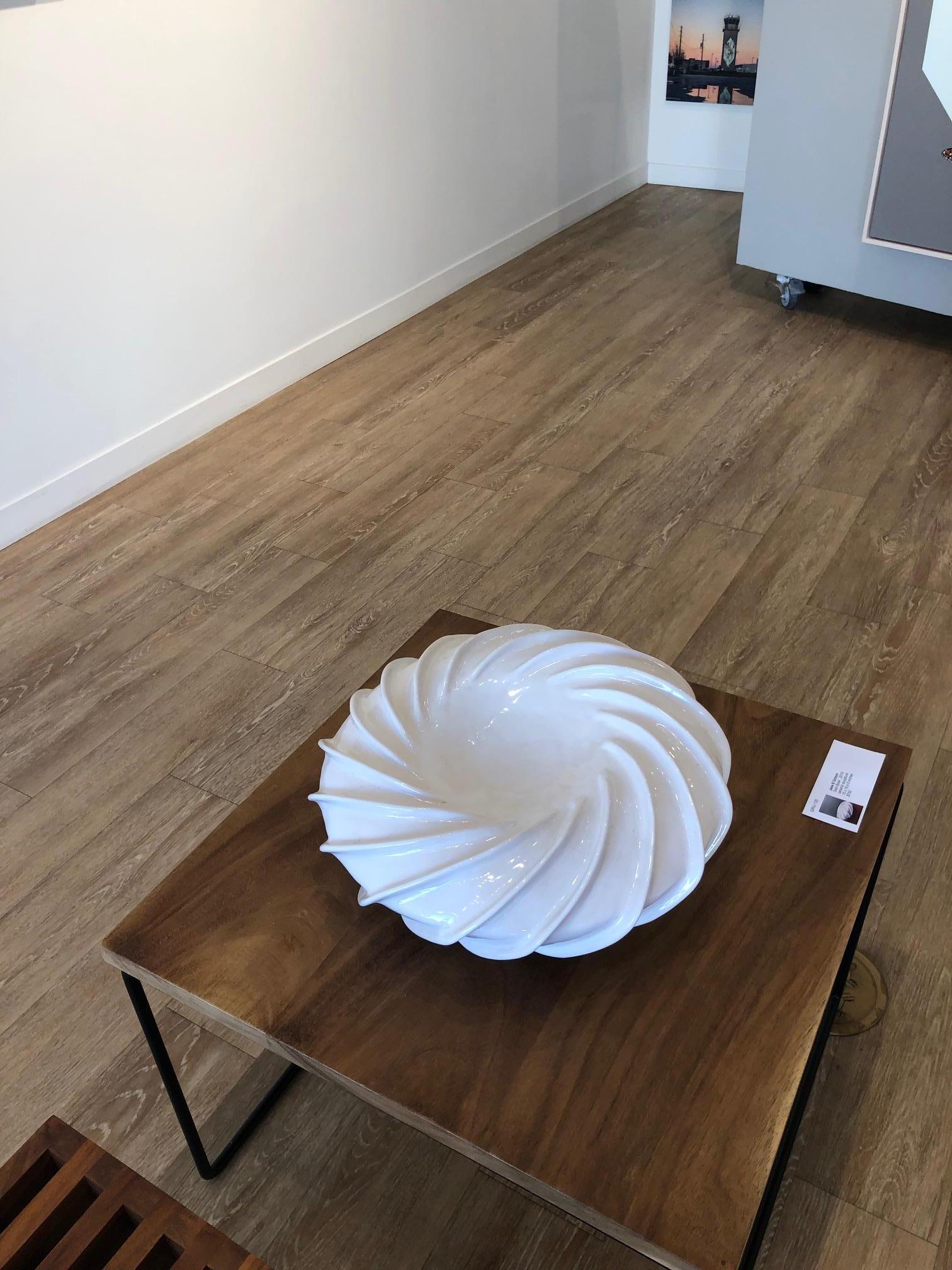 White circular abstract table sculpture from Pop Art pioneer Jane B. Grimm, who began her artistic career in the 1960’s, when her free-form sculptural jewelry exploded onto the fashion scene in NYC. Her designs spoke to a new generation well into
