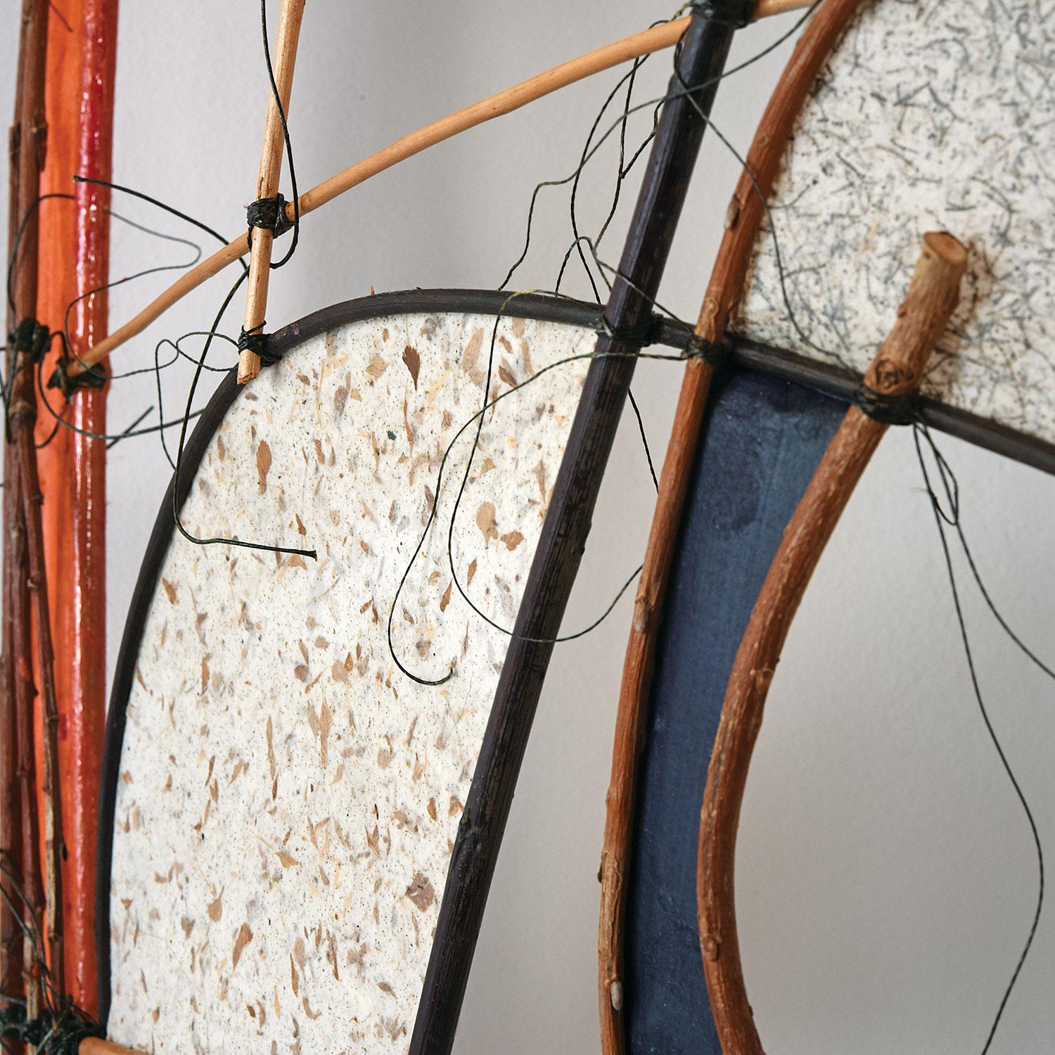 This abstract boat wall sculpture by Danish artist, Jane Balsgaard, is constructed with iron, bamboo, willow, fishing line and handmade plantpaper. 

Balsgaard is often known for her particular use of wood and paper to create sculptures that