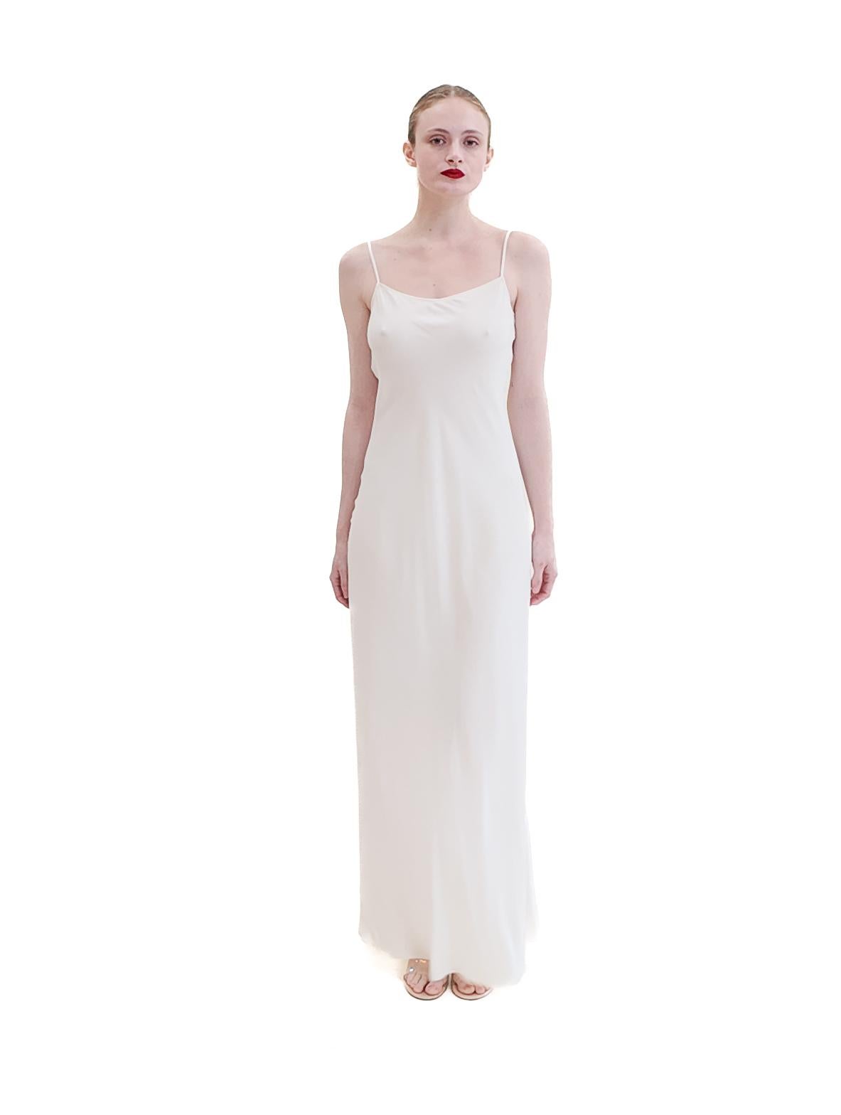 Effortlessly elegant, the Jane Booke White Low Back Slip Dress is crafted from luxurious silk in a bias cut for a flattering silhouette. Perfect for romantic occasions, wedding weeks, or casual wear, this versatile dress is a must-have for your