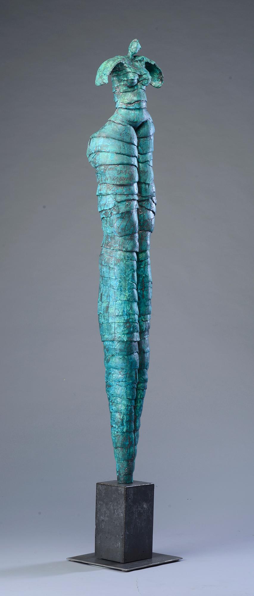 A larger than life figurative sculpture by Jane Burton. This one of a kind piece is well suited for a contemporary interior. when viewed up close, one can appreciate the handwritten script incorporated into the blue patina. The forms Burton sculpts