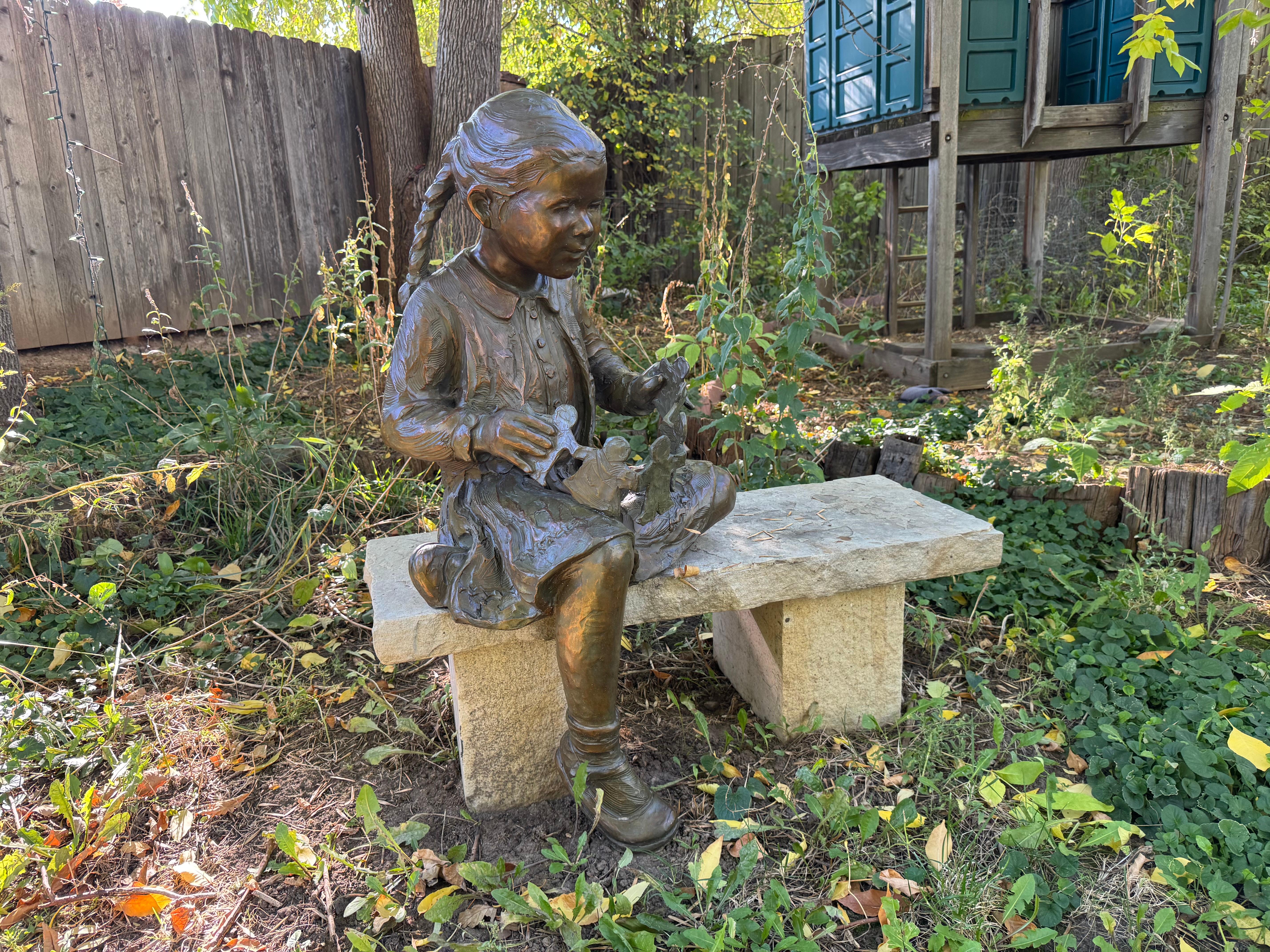 Cutouts, 41" high bronze with stone bench