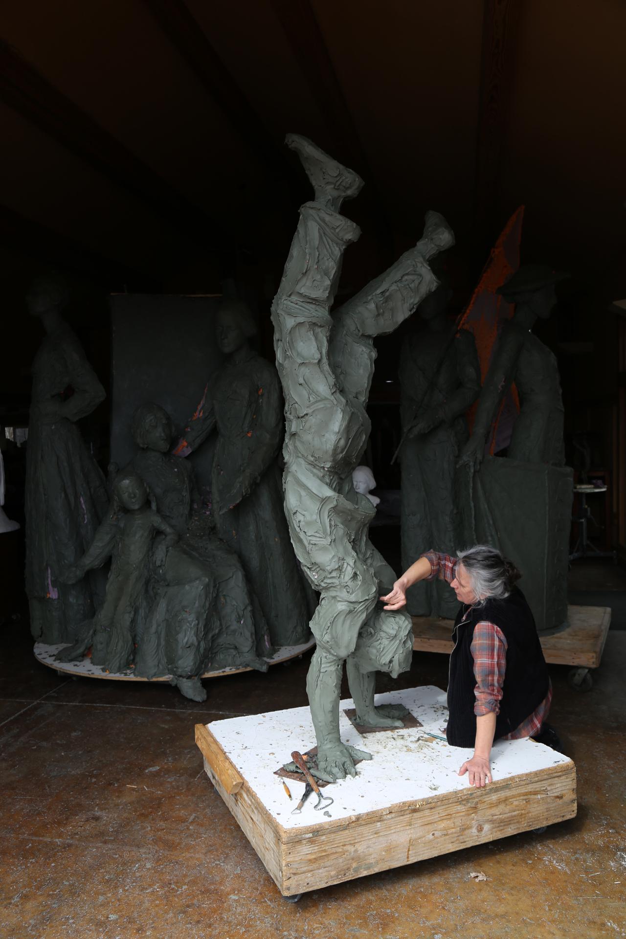 From a Different Perspective, 8ft high Bronze - Gold Figurative Sculpture by Jane DeDecker