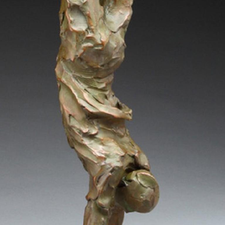 Bronze sculpture of a figure doing a handstand.
Edition of 17