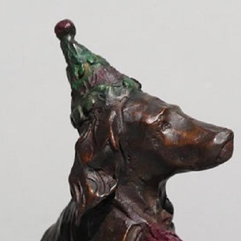 Bronze sculpture of a dog wearing a party hat.
Edition of 50