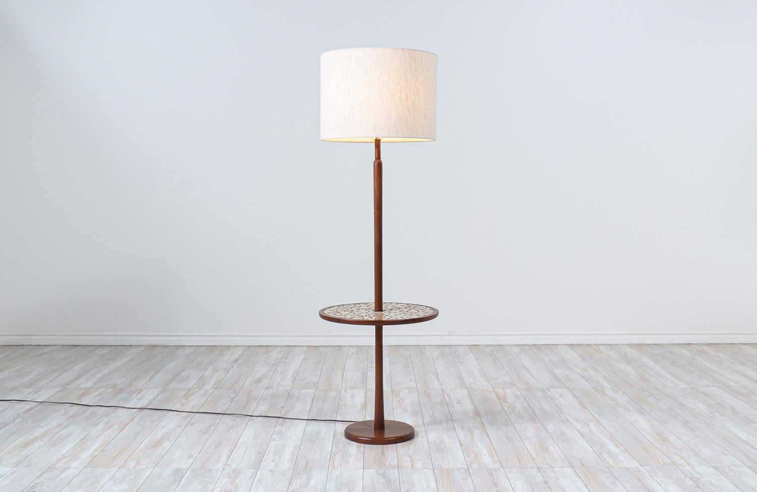Dimensions:

60in H x 19in W x 19in D 

Lamp shade: 13in H x 18in W 
Side table height: 20in.