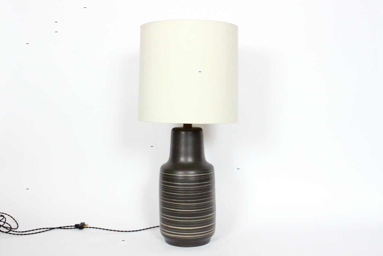 Gordon Martz for Marshall Studios Brown Banded Art Pottery Table Lamp, 1950's. Featuring a classic handcrafted Marshall Studios ceramic barrel form, matte glaze, Dark Bronze finish, hand painted with Beige and Olive Green banding. Walnut neck. Shade