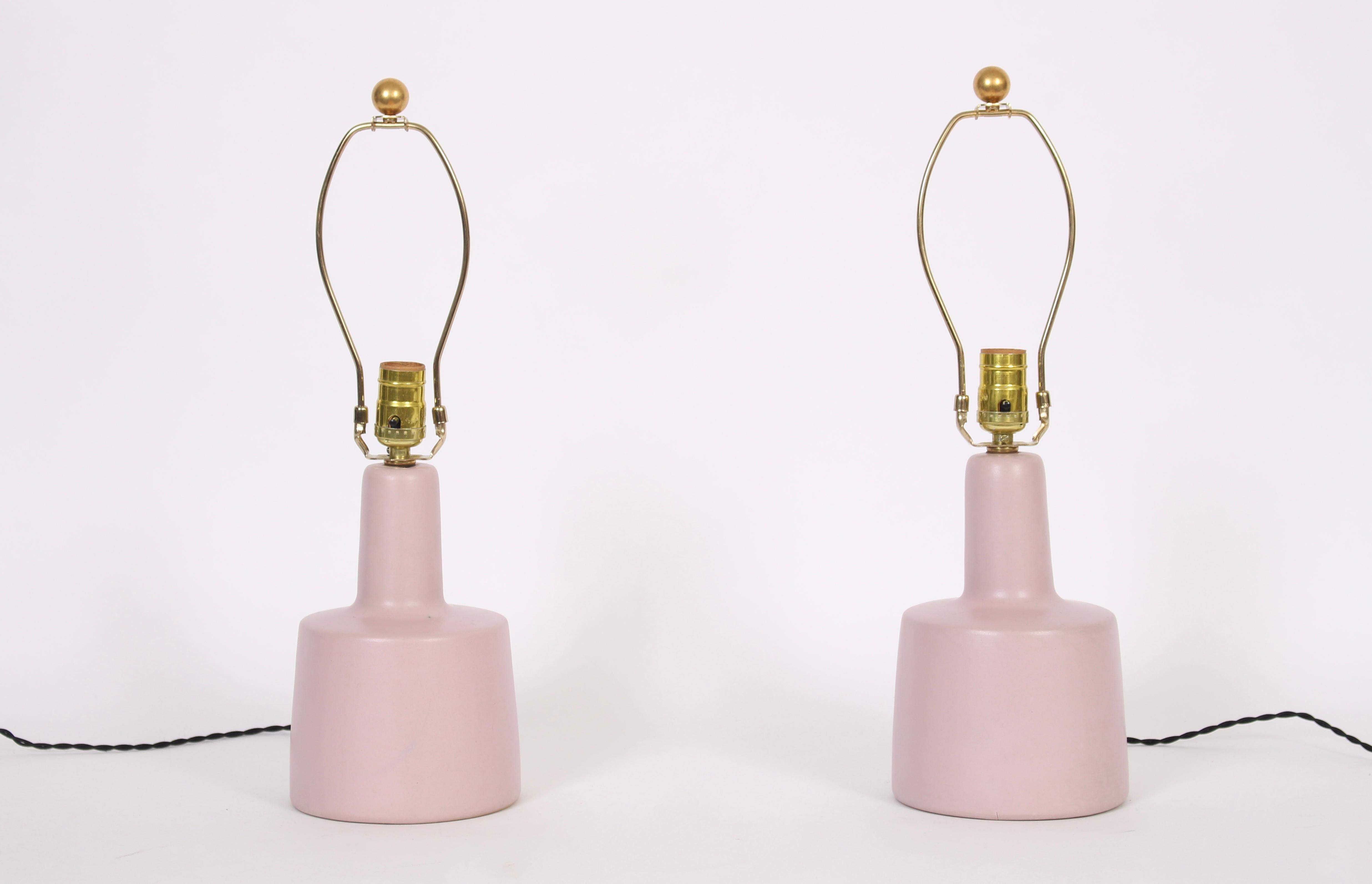 Smaller pair of Jane & Gordon Martz for Marshall Studios matte glazed Pale Pink Table Lamps, circa 1960. Classic. Soft. Small footprint. 12 H to socket, 6 D base. Shades shown for display only (9.5 H x 12 D top x 13 D bottom). Without chips or