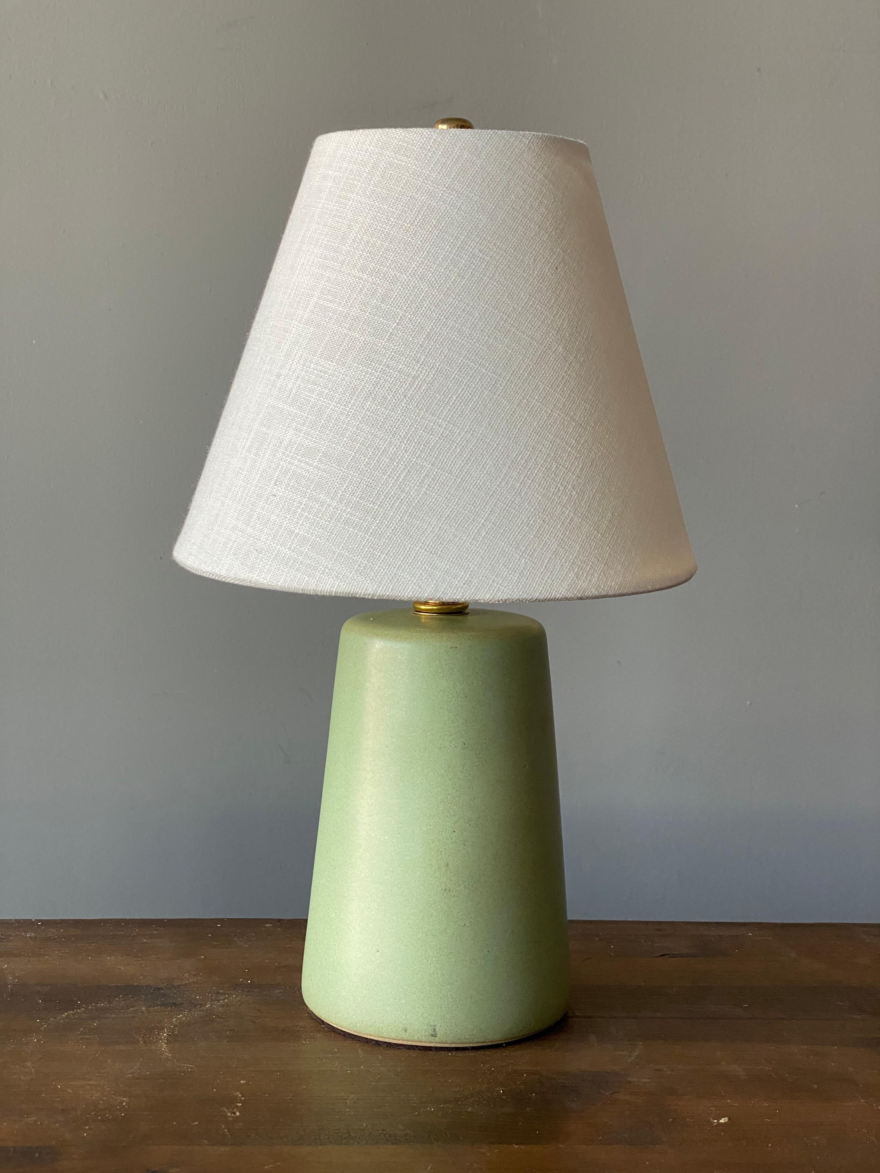 A table lamp designed by husband and wife duo Jane & Gordon Martz. Produced by Marshall Studios, Indianapolis. 

The base is slip-cast and then dipped into glaze and hand painted. Base is signed.

Lampshade on bulb-clip is not included in