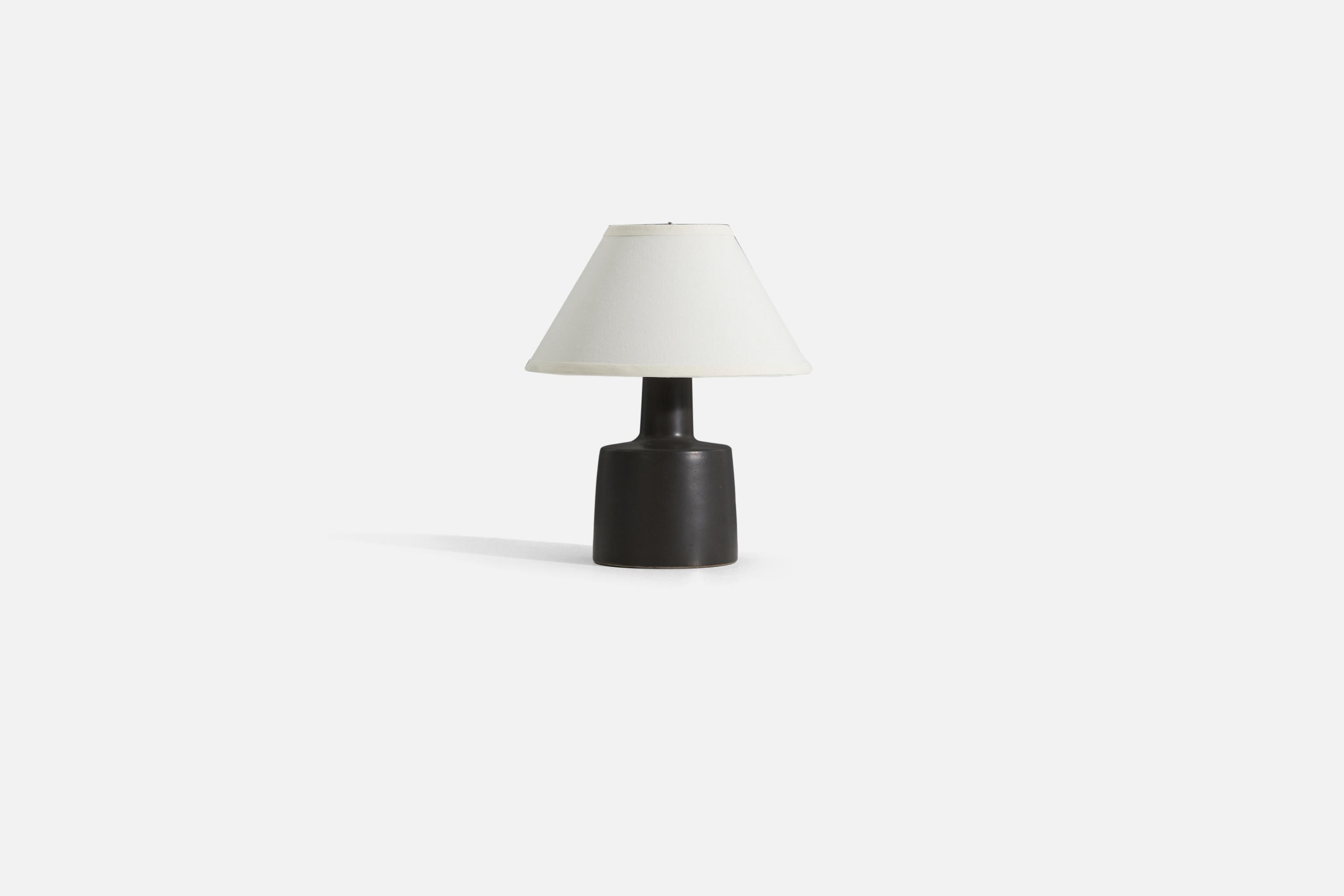 A table lamp designed by husband and wife duo Jane & Gordon Martz, produced by Marshall Studios, Indianapolis. The base is slip-cast, dipped into glaze, and signed.

Sold without lampshade. 
Dimensions of Lamp (inches) : 12.25 x 6.25 x 6.25 (H x