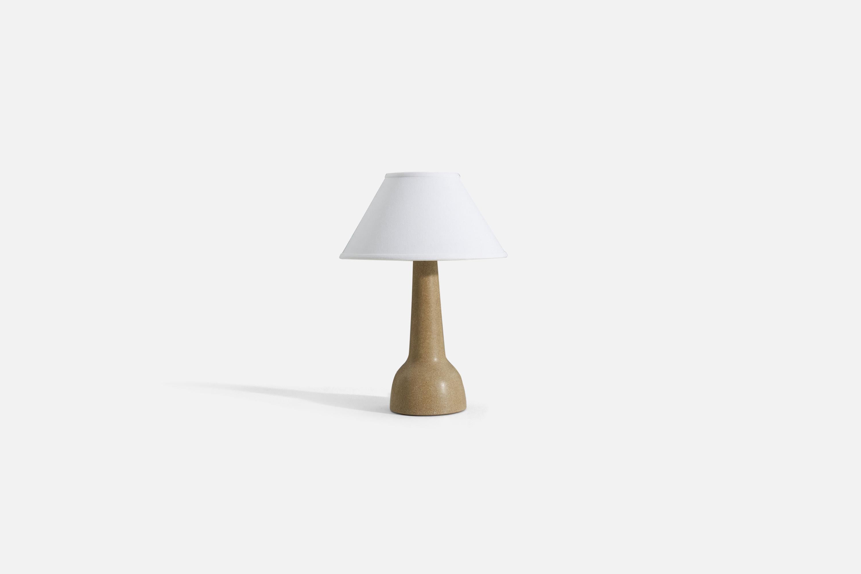 A table lamp designed by husband and wife duo Jane & Gordon Martz, produced by Marshall Studios, Indianapolis. The base is slip-cast, dipped into glaze, and signed.

Sold without lampshade. 
Dimensions of Lamp (inches) : 15.25 x 5.75 x 5.75 (H x