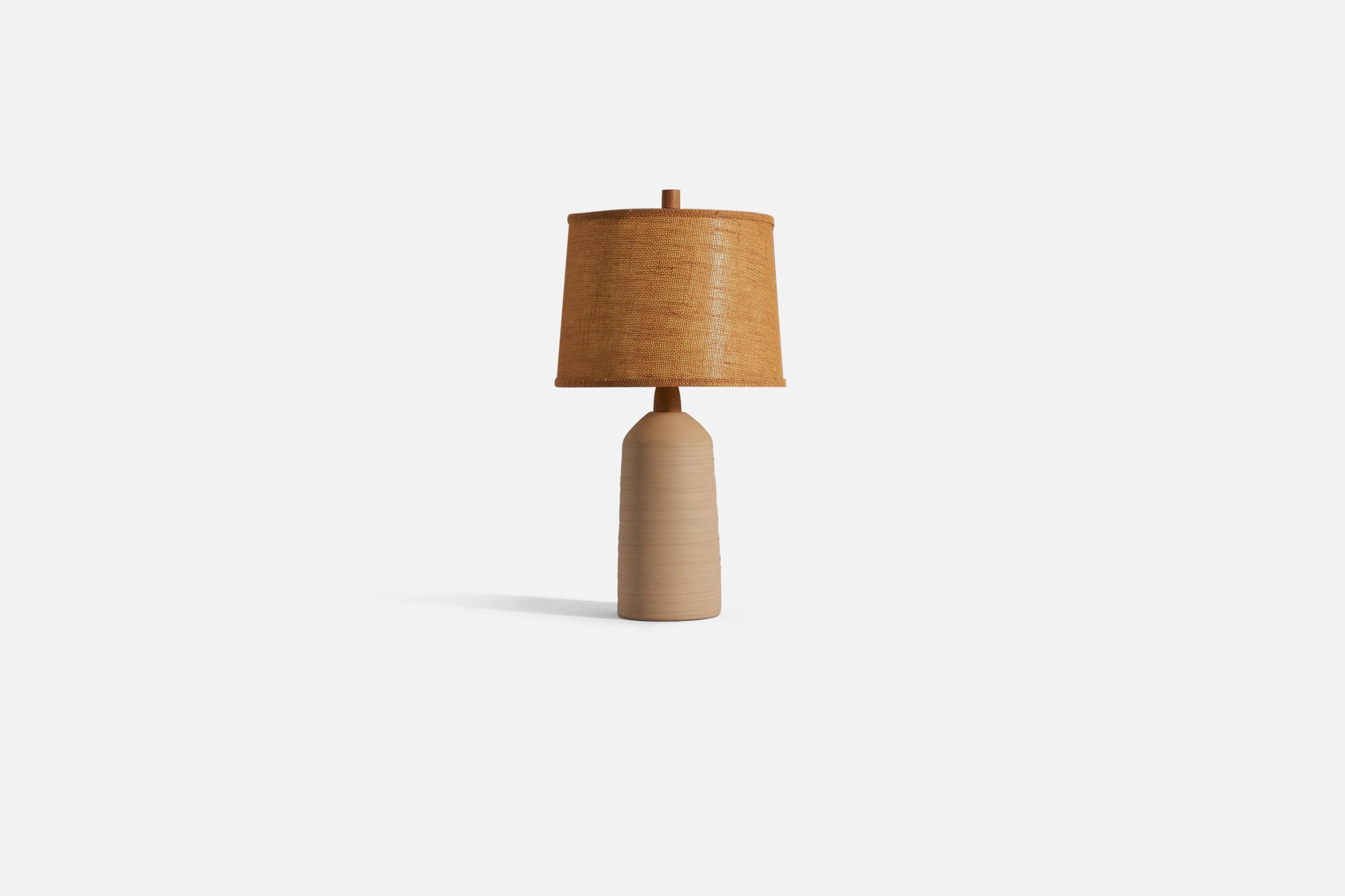 A table lamp designed by husband and wife duo Jane & Gordon Martz. Produced by Marshall Studios, Veedersburg, Indiana. 

The base is slip-cast and signed.

Sold with lampshade and finial. 
Dimensions of lamp (inches) : 28.25 x 6.75 x 6.75 (H x