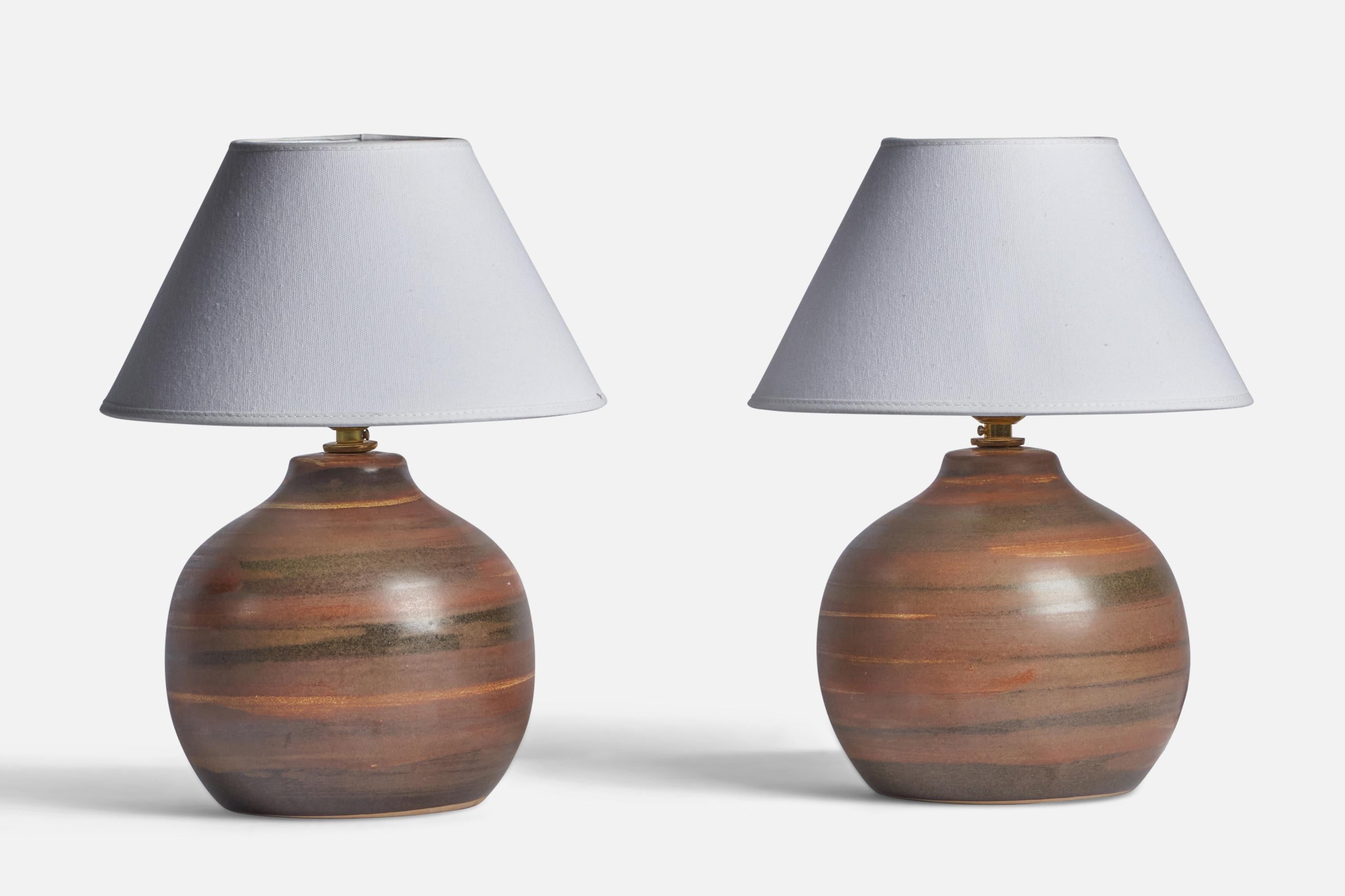 A pair of brown-glazed ceramic table lamps designed by Jane & Gordon Martz and produced by Marshall Studios, USA, 1960s.

Dimensions of Lamp (inches): 9.75” H x 7.25” Diameter
Dimensions of Shade (inches): 4.5” Top Diameter x 10” Bottom Diameter x