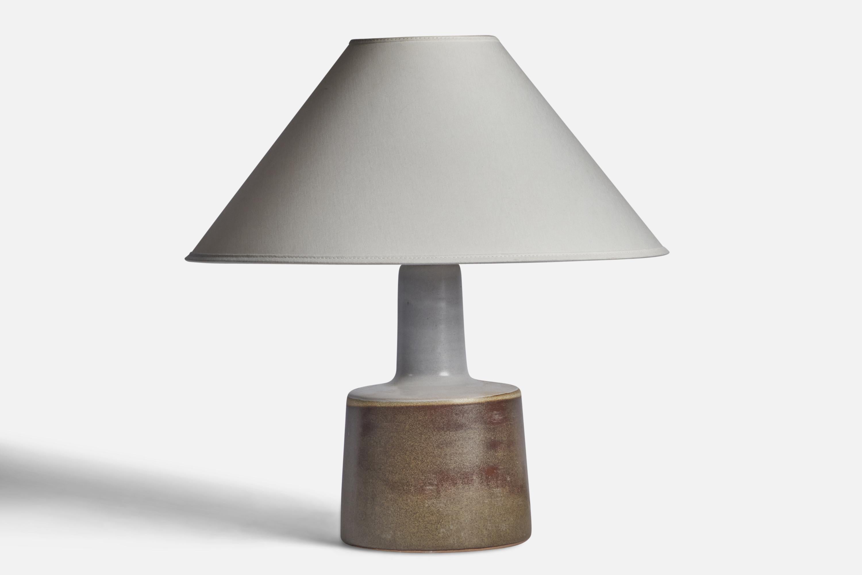 A grey and brown-glazed ceramic table lamp designed by Jane & Gordon Martz and produced by Marshall Studios, USA, 1960s.

Dimensions of Lamp (inches): 12.25” H x 6.25” Diameter
Dimensions of Shade (inches): 4.5” Top Diameter x 15.75” Bottom Diameter