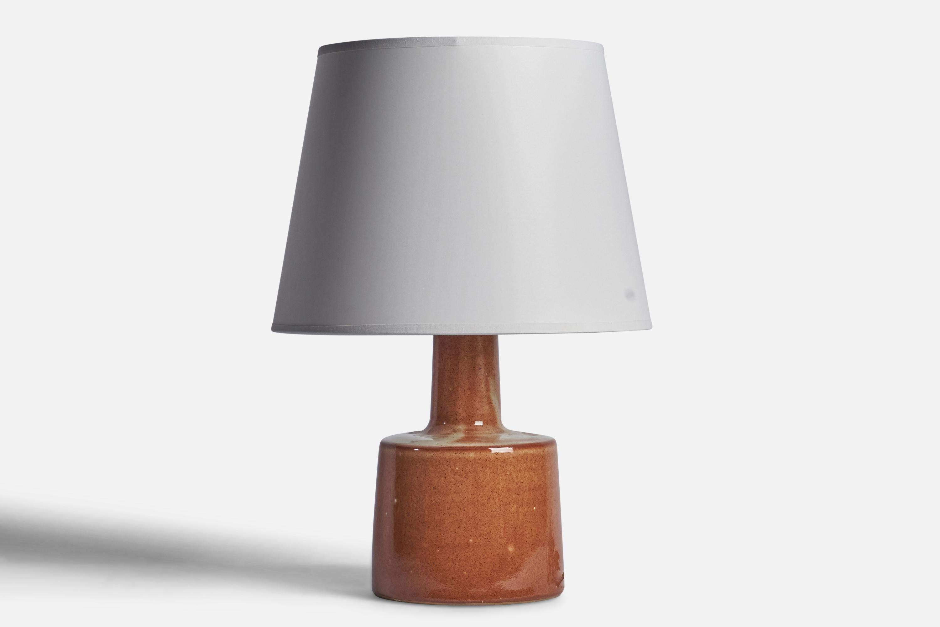 A brown-glazed ceramic table lamp designed by Jane & Gordon Martz and produced by Marshall Studios, USA, 1960s.

Dimensions of Lamp (inches): 12” H x 6” Diameter
Dimensions of Shade (inches): 8.75” Top Diameter x 12” Bottom Diameter x 9” H