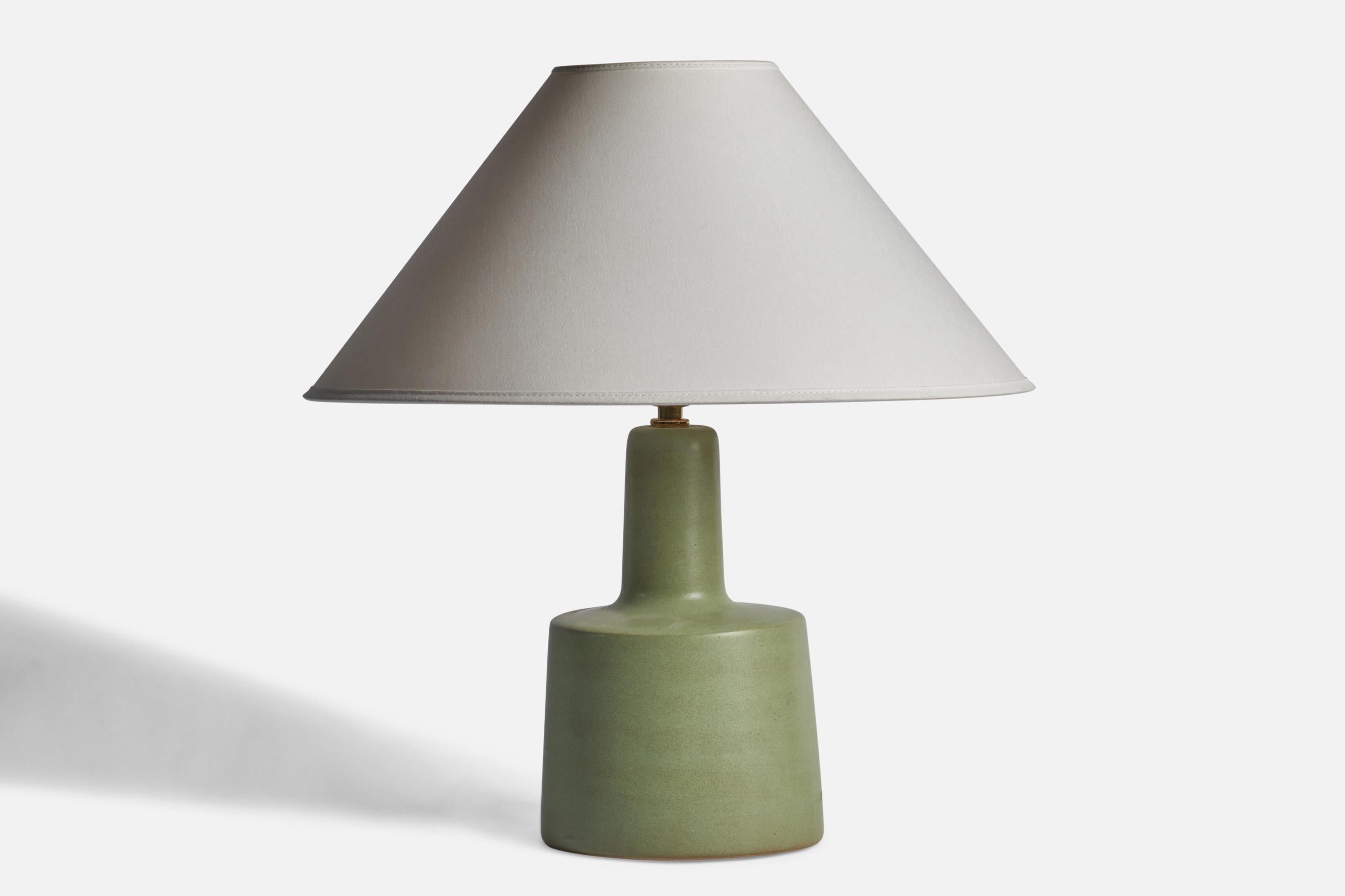 A green-glazed ceramic table lamp designed by Jane & Gordon Martz and produced by Marshall Studios, USA, 1960s.

Dimensions of Lamp (inches): 12.25” H x 6” Diameter
Dimensions of Shade (inches): 9” Top Diameter x 12” Bottom Diameter x 9”