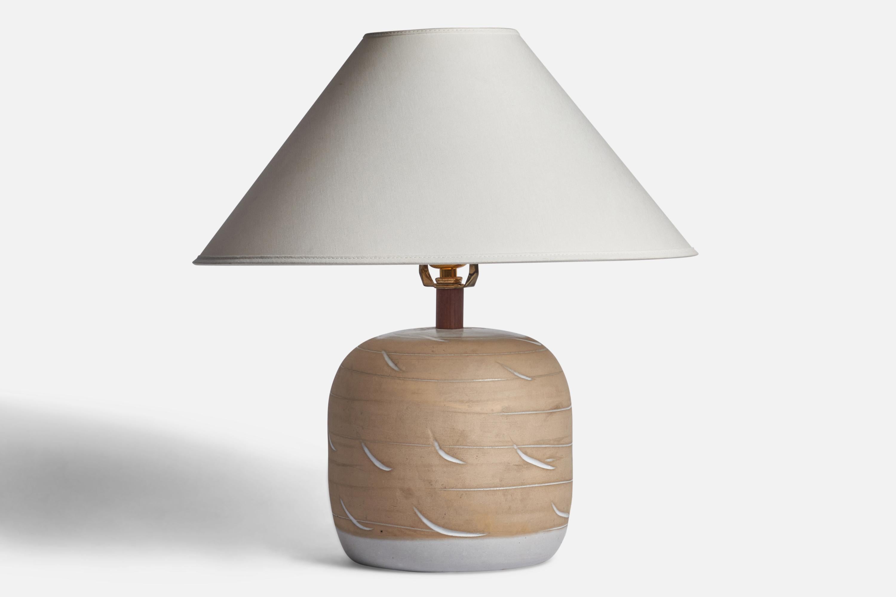 A grey and beige-glazed ceramic table and walnut lamp designed by Jane & Gordon Martz and produced by Marshall Studios, USA, 1960s.

Dimensions of Lamp (inches): 12” H x 8” Diameter
Dimensions of Shade (inches): 4.5” Top Diameter x 15.75” Bottom