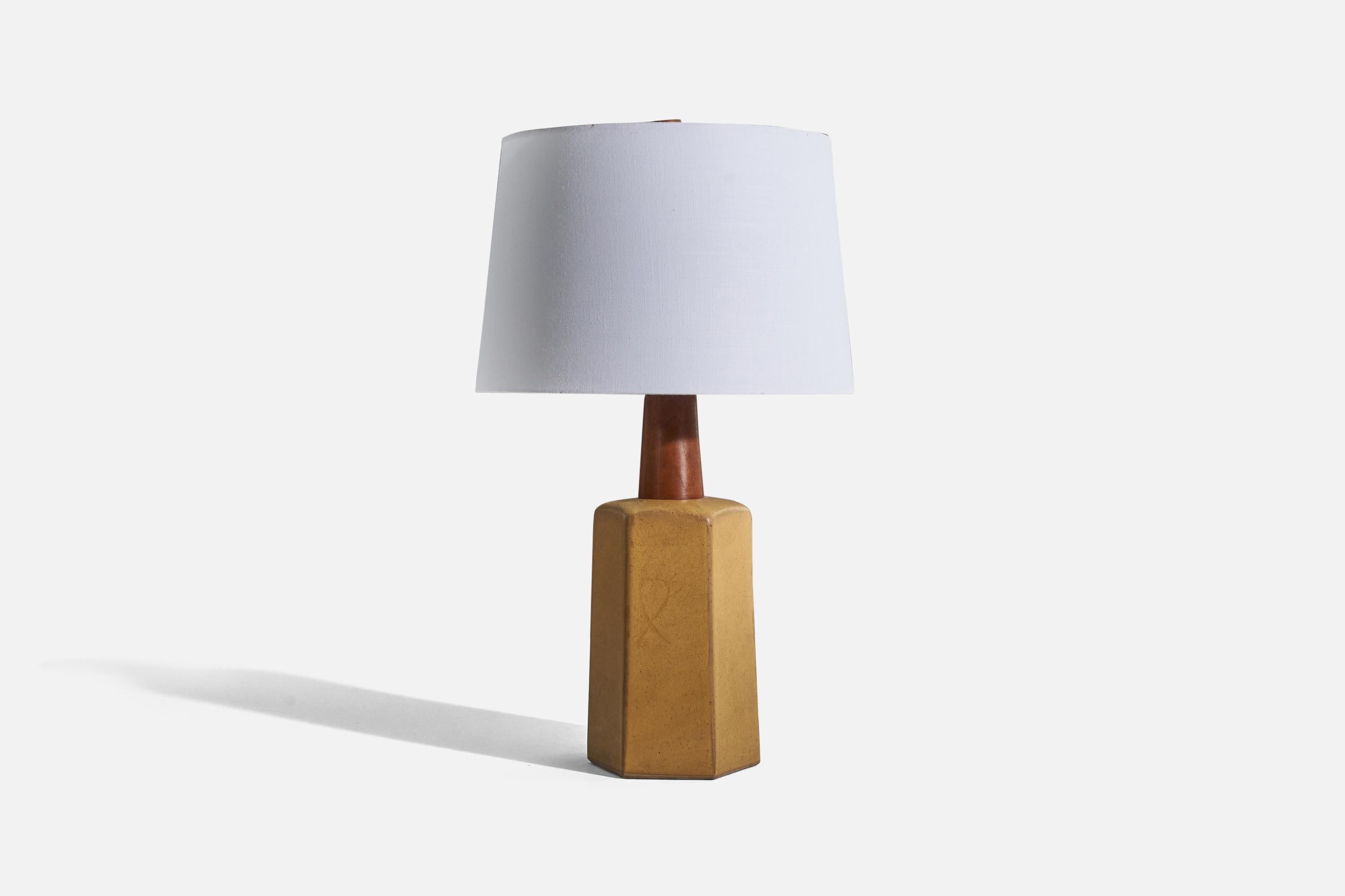A ceramic and wood table lamp, designed by husband and wife duo Jane & Gordon Martz, produced by Marshall Studios, Indianapolis, United States, 1960s.

Sold without lampshade. 
Dimensions of lamp (inches) : (H 18 x W 7.12 x D 6)
Dimensions shade