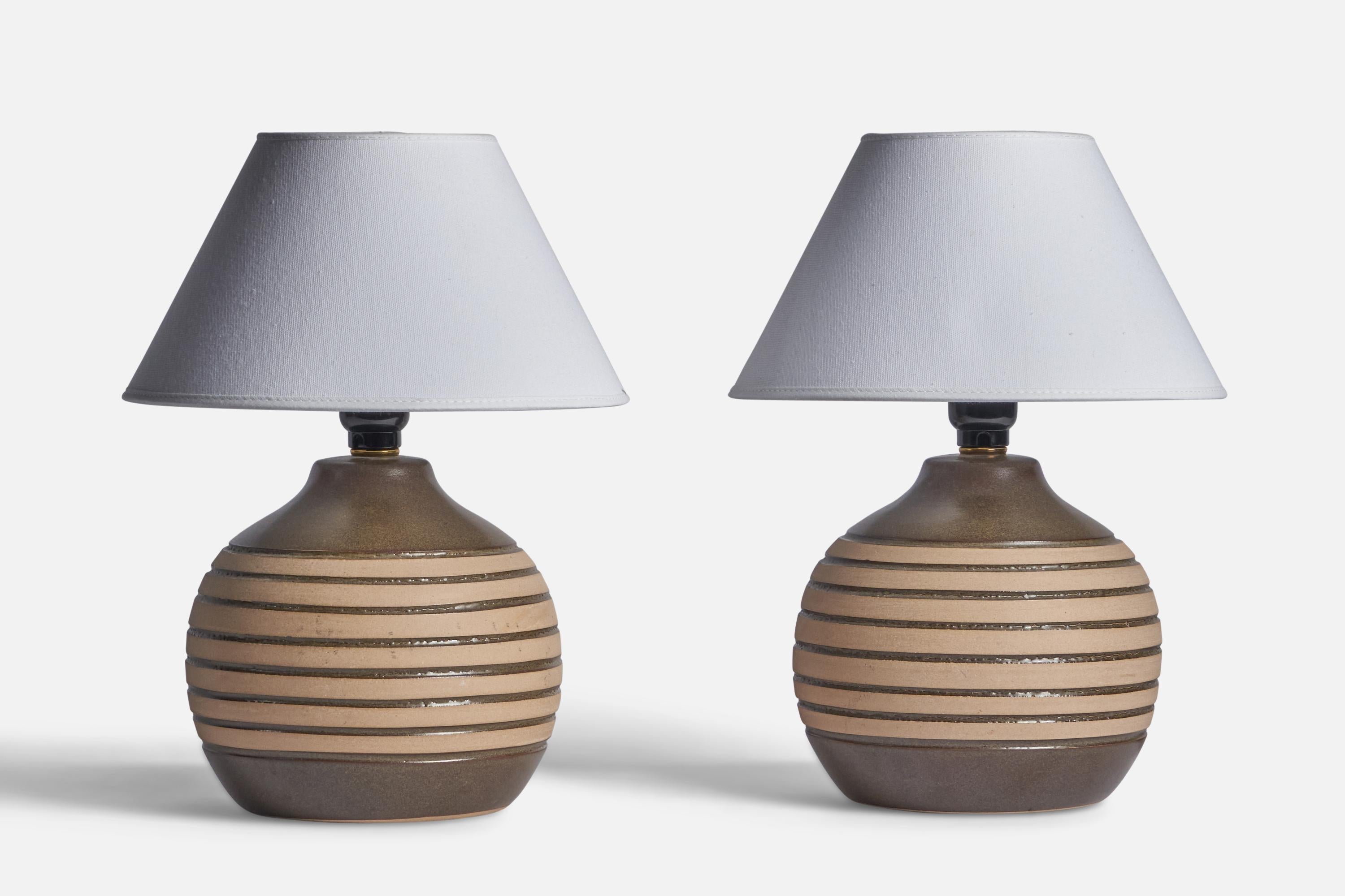 A pair of grey and beige-glazed ceramic table lamps designed by Jane & Gordon Martz and produced by Marshall Studios, USA, 1960s.

Dimensions of Lamp (inches): 10.25” H x 7.25” Diameter
Dimensions of Shade (inches): 4.5” Top Diameter x 10” Bottom