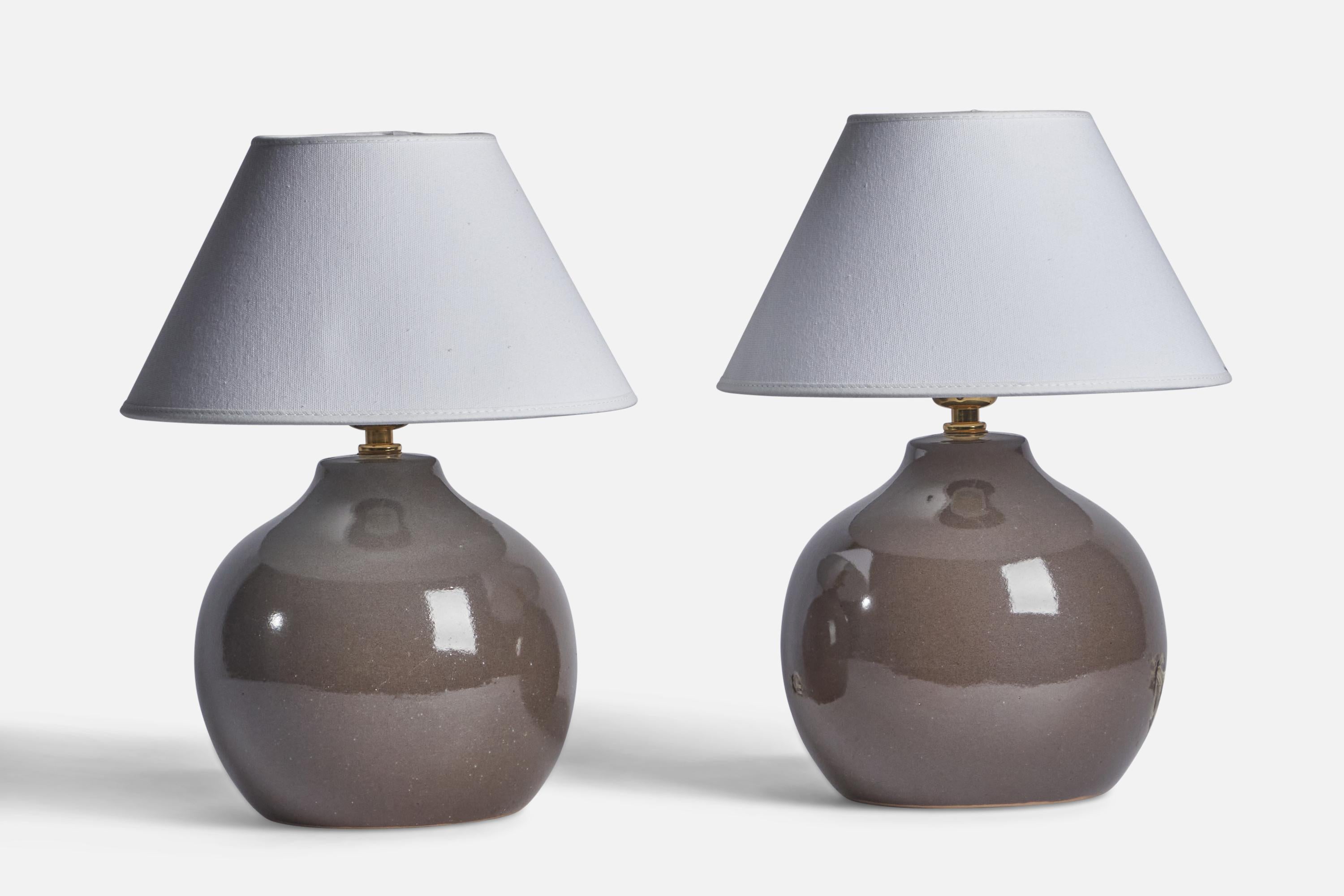 A pair of grey-glazed ceramic table lamps designed by Jane & Gordon Martz and produced by Marshall Studios, USA, 1960s.

Dimensions of Lamp (inches): 9.75” H x 7.25” Diameter

Dimensions of Shade (inches): 4.5” Top Diameter x 10” Bottom Diameter x