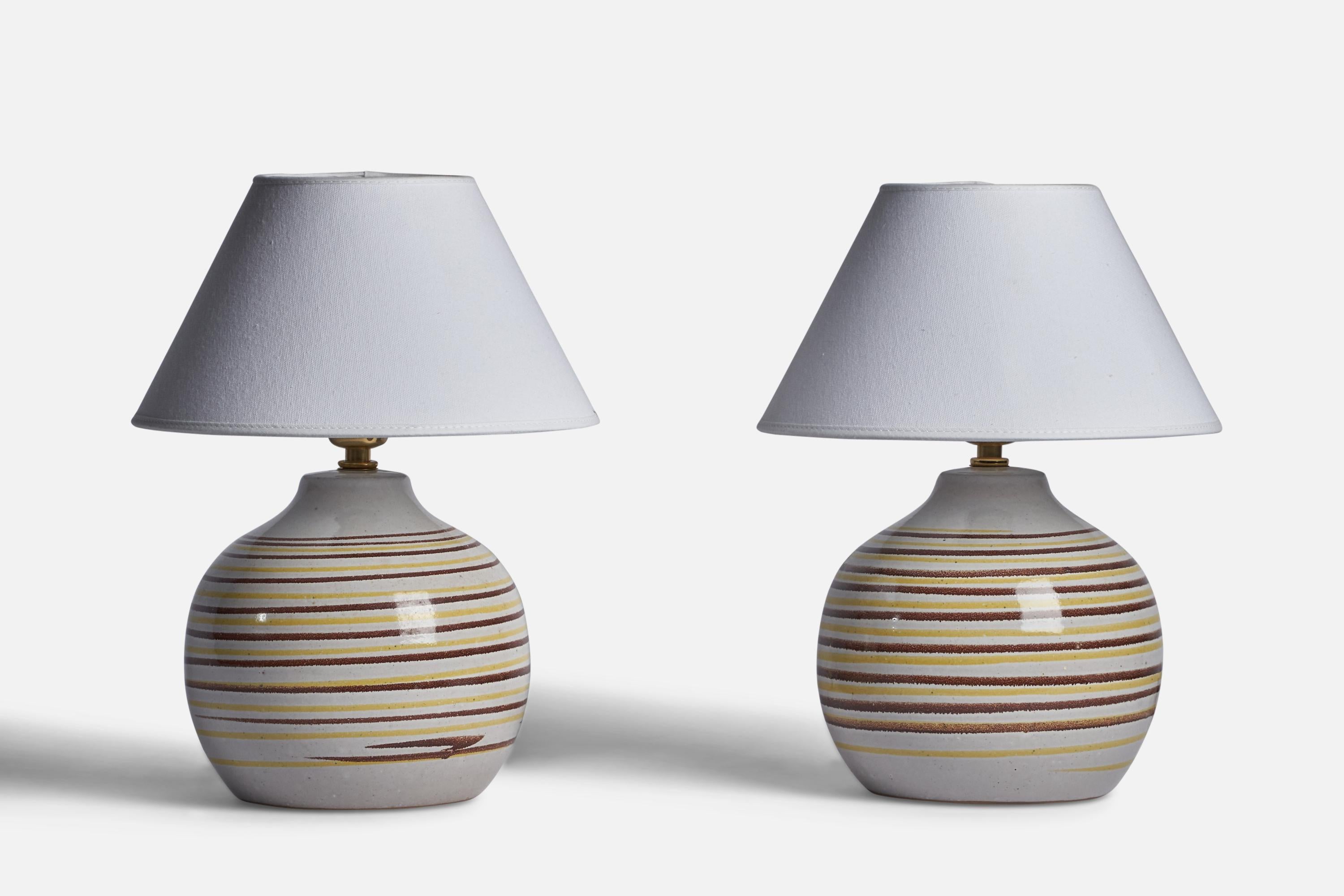 A pair of light grey and brown and yellow-glazed ceramic table lamp designed by Jane & Gordon Martz and produced by Marshall Studios, USA, 1960s.

Dimensions of Lamp (inches): 10” H x 7.15” Diameter
Dimensions of Shade (inches): 4.5” Top Diameter x
