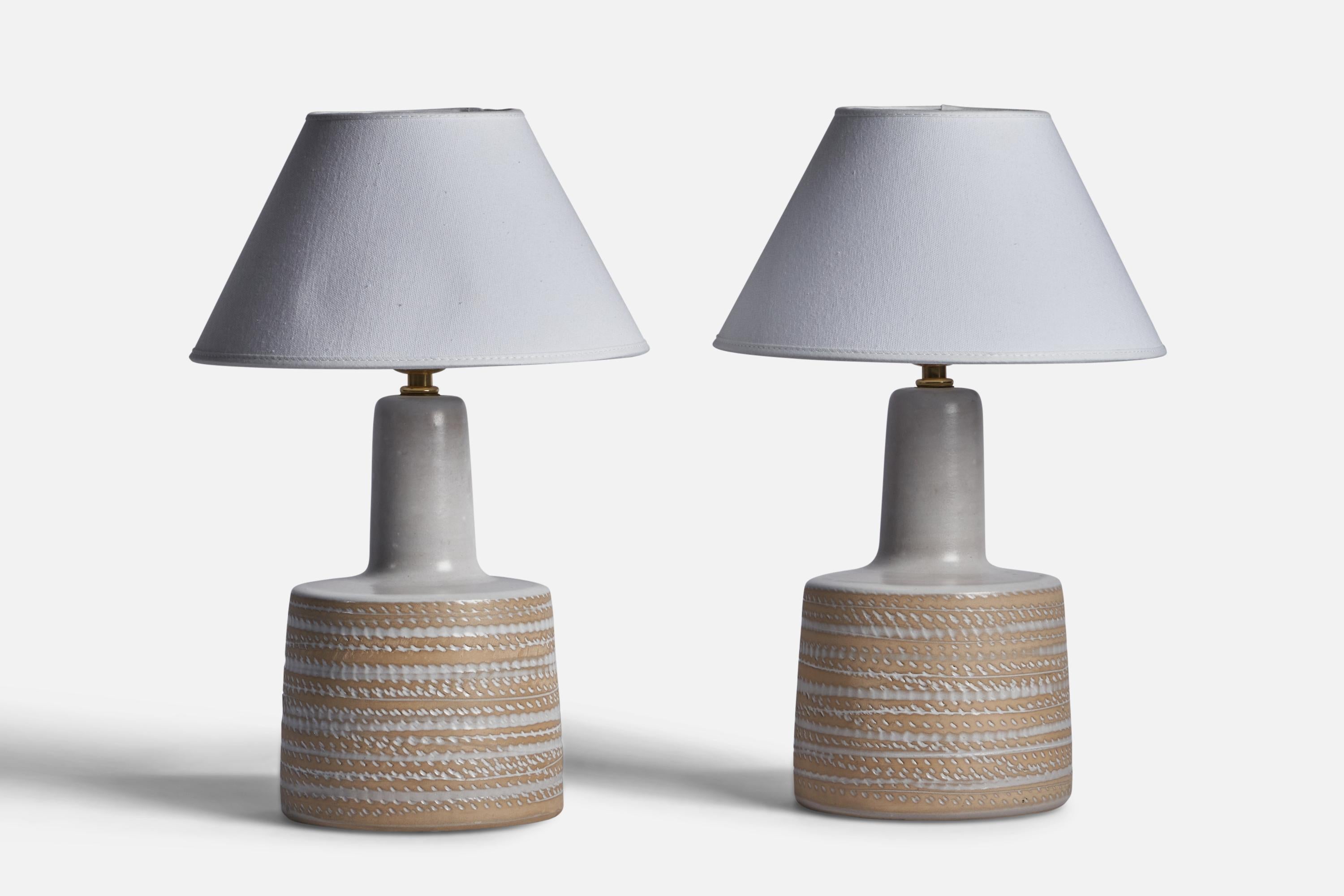 A pair of grey and beige-glazed ceramic table lamps designed by Jane & Gordon Martz and produced by Marshall Studios, USA, 1960s.

Dimensions of Lamp (inches): 12” H x 6.25” Diameter
Dimensions of Shade (inches): 4.5” Top Diameter x 10” Bottom