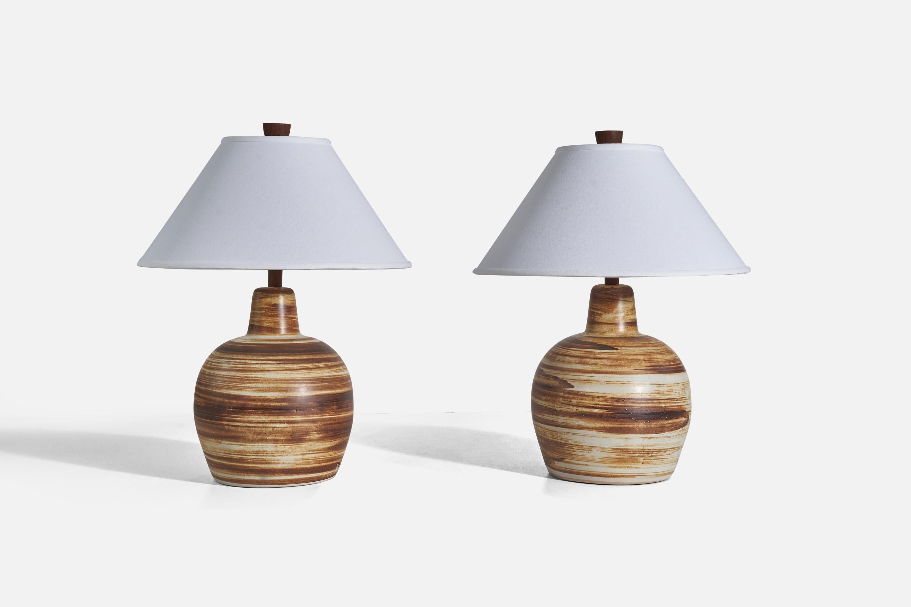 A pair of brown and white ceramic and walnut table lamps designed by Jane & Gordon Martz and produced by Marshall Studios, Indianapolis, 1950s.

Sold without Lampshade
Dimensions of Lamp (inches) : 15.56 x 9.5 x 9.5 (Height x Width x
