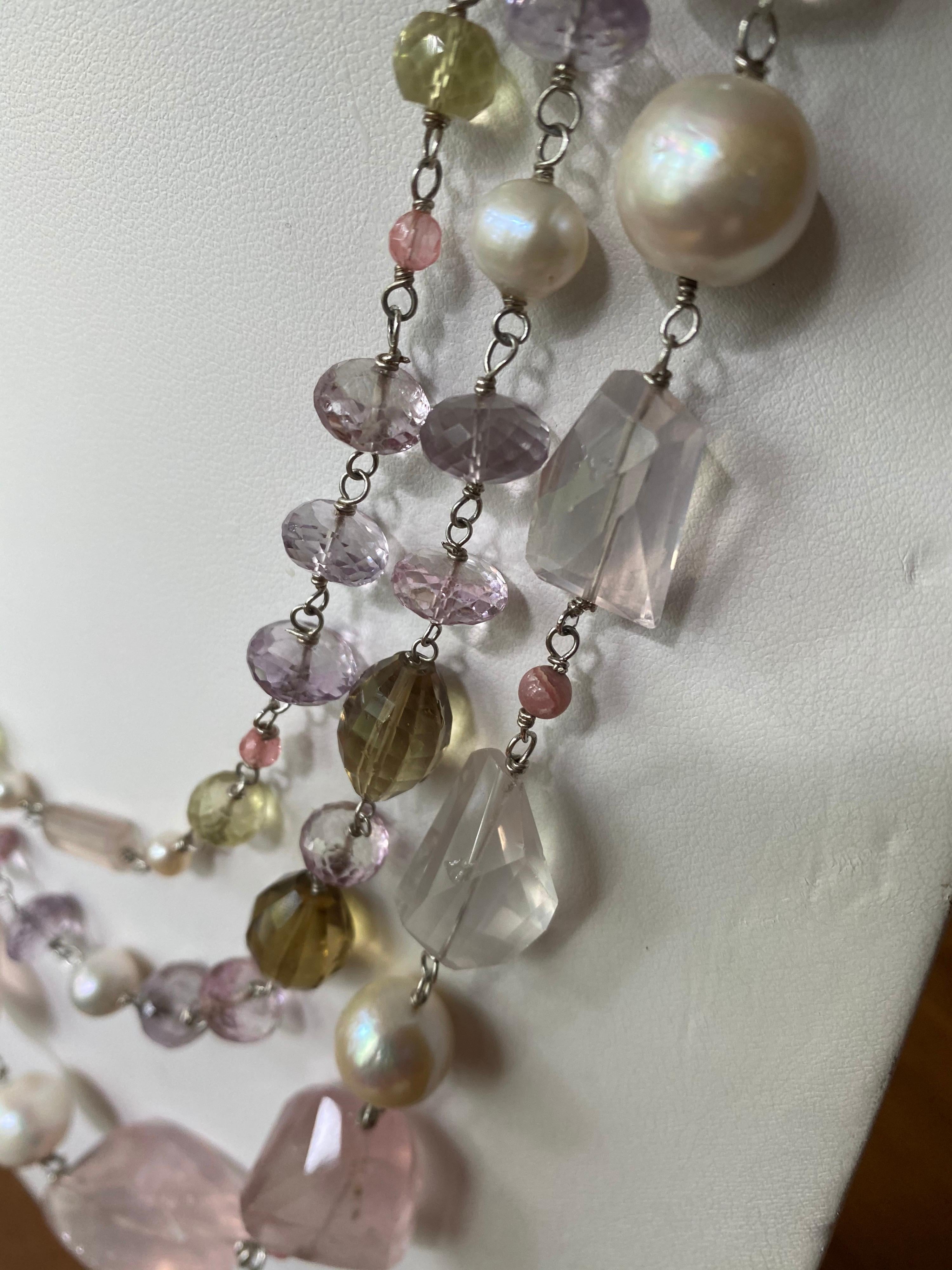 Jane Magon Collections delightful Three Strands of Rose Quartz, Lemon Citrines, Beer Quartz, Pink Topaz, Pink Amethyst Faceted Rndelles, Freshwater Pearls, and a large Wide Pear Shaped Lemon Citrine set in the Sterling Silver Clasp. Add this to your