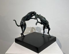 El espectáculo   Una escultura original de bronce que representa a unos galgos jugando