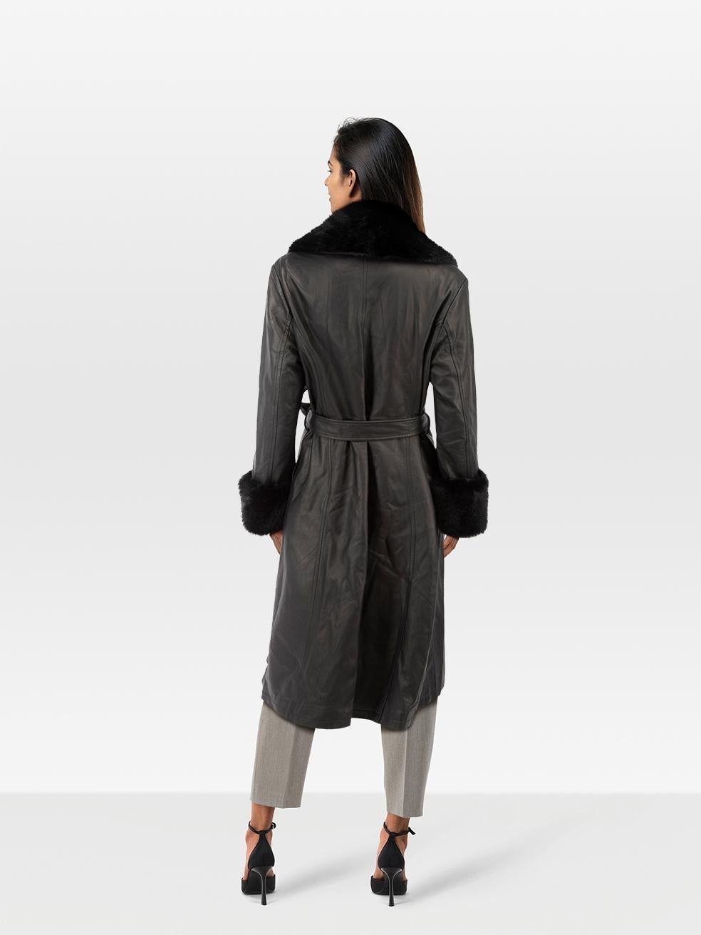 CONDITION is Very good. Minimal wear to the coat is evident. Abrasion on the front left, front right, right sleeve and waist belt on this used Jane and Tash designer resale item.
 
 Details
 
 
 Black
 
 Leather
 
 Coat
 
 Long
 
 Single breasted
 

