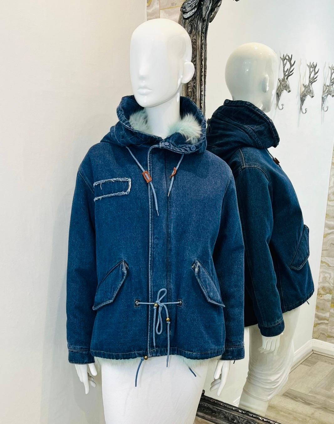 Brand New - Jane & Tash Denim & Fox Fur Parka Coat

Dark blue parka designed with baby blue Fox fur interior and Raccoon lined hood.

Detailed with drawstrings to the hood and waist.

Featuring flap pockets to the sides and zip and snap centre