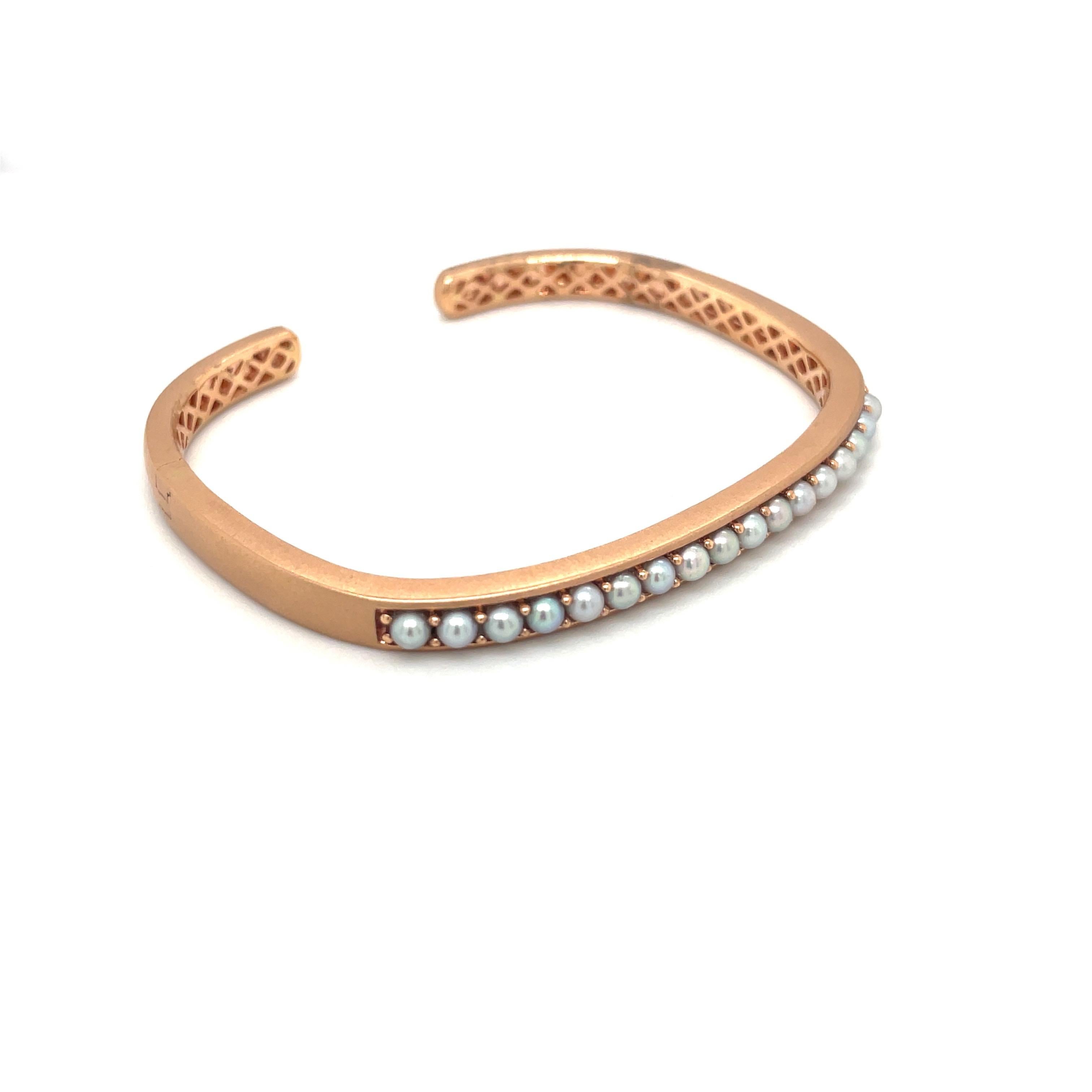 Jane Taylor Jewelry is a family run company focused on creating modern heirlooms since 1994.
This 18 karat rose gold cuff bracelet has a squarish shape and a matte finish. It is set across the top with 17  3mm Pearls The bracelet has an invisible